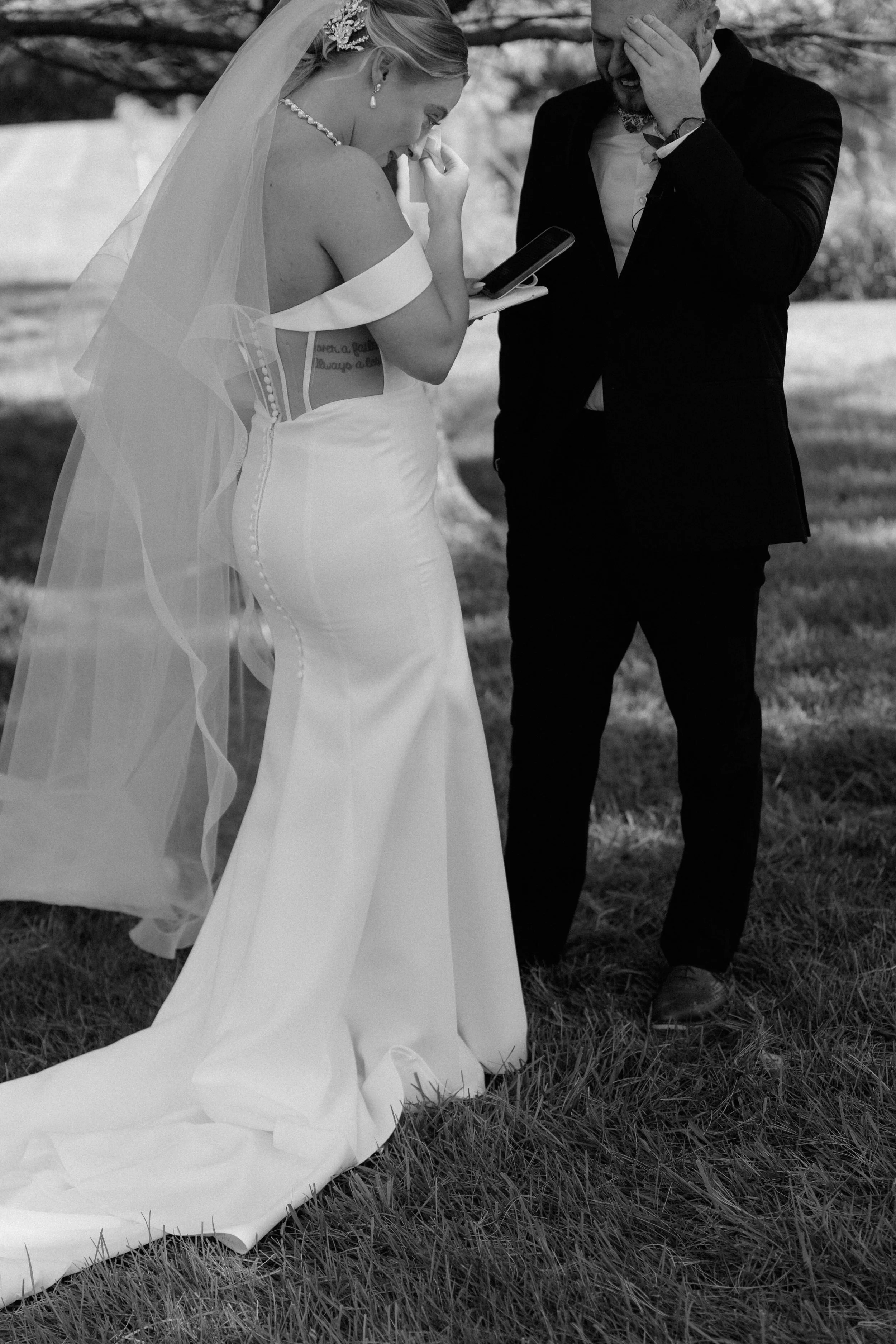 Bride and groom emotional and crying happy tears while reading private vows to her groom during their first look in Rockton Illinois, documentary wedding photography by Nicole Kilday