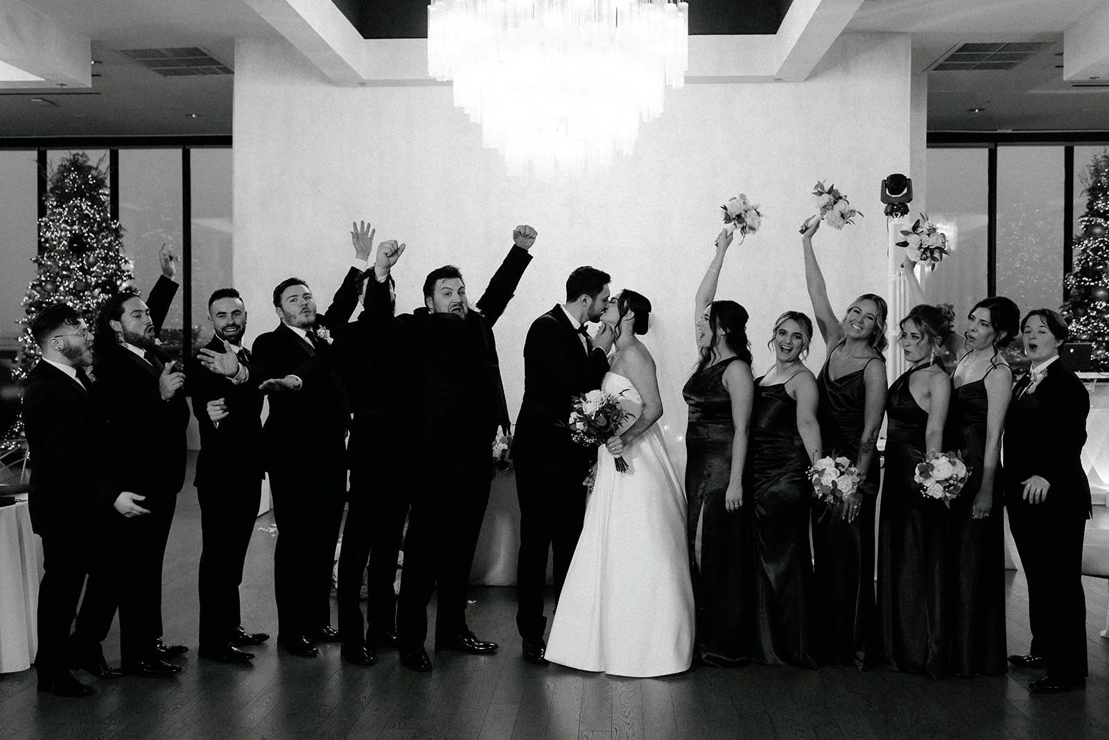 December wedding indoors bridal party celebrating the marriage of Ashley & Cole at Sky On Nine in Rosemont Illinois by Nicole Kilday