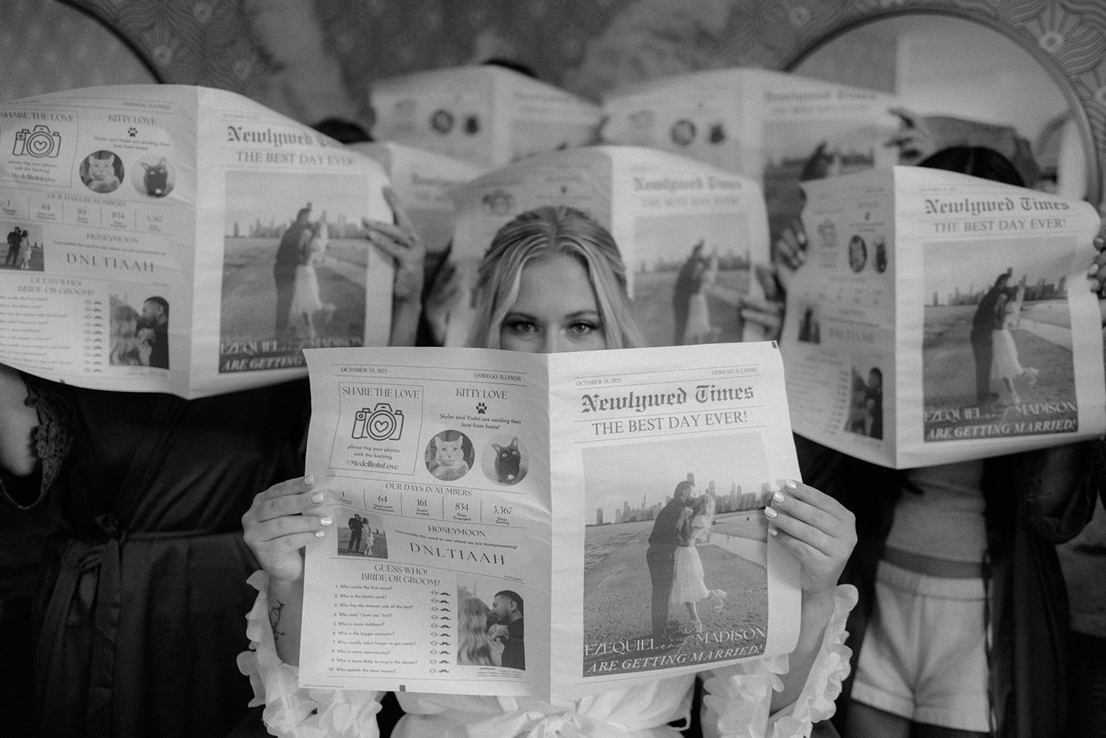 Bridesmaids holding custom Newlywed Times wedding newspapers at Venue 5126 in Oswego Illinois, documentary wedding photography by Nicole Kilday