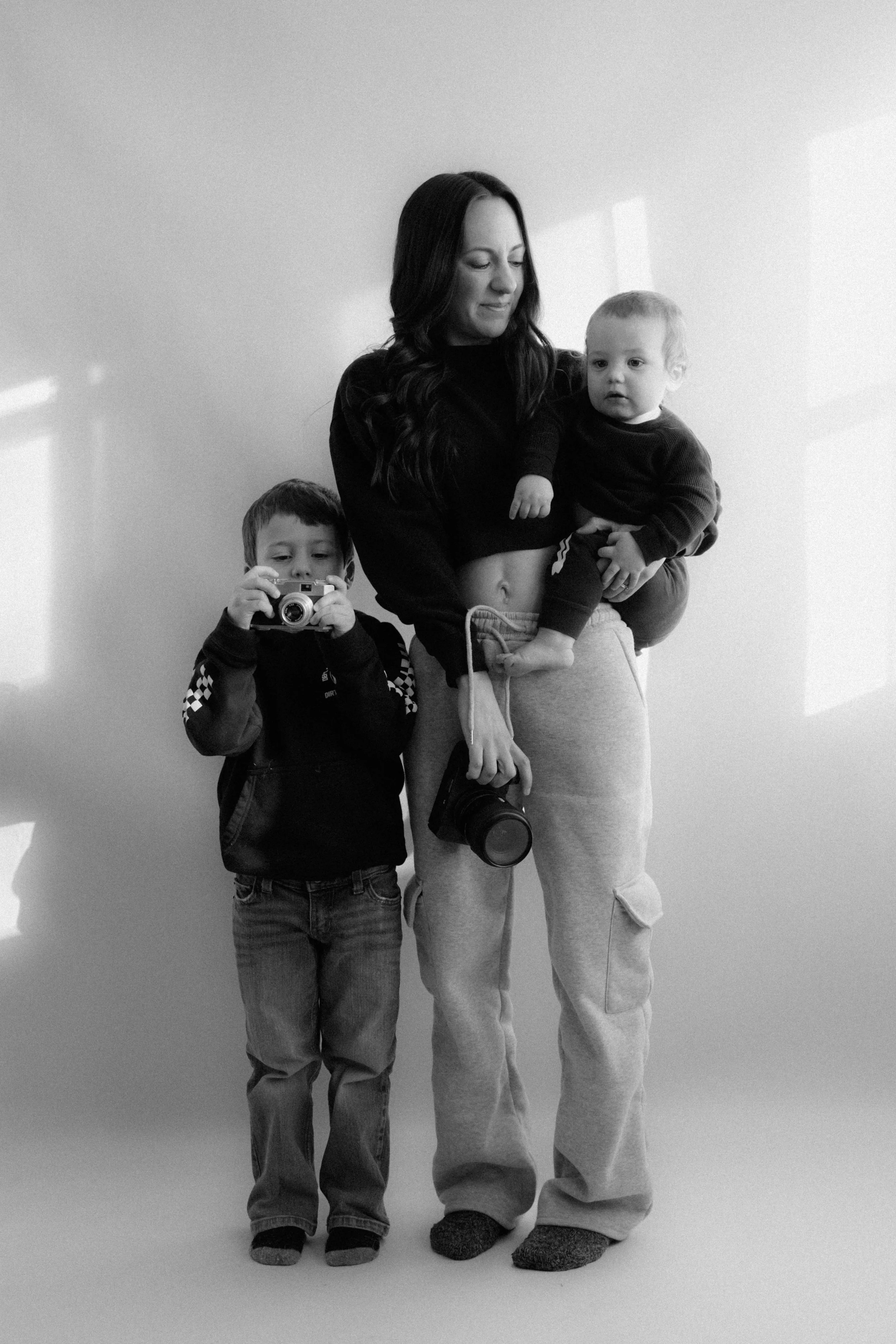 Nicole Kilday, Illinois wedding photographer and creator of the SEO and AI Visibility Framework for photographers, with her two sons