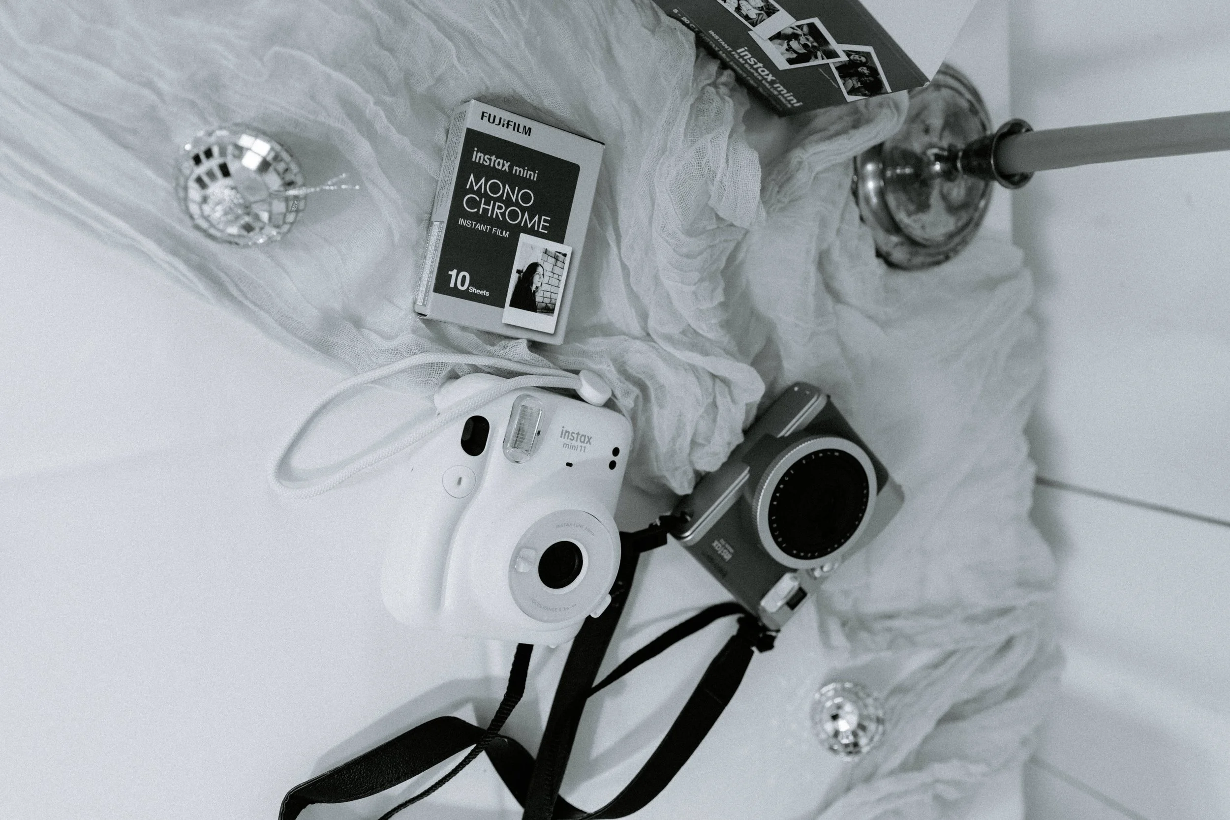 Instax cameras and film flatlay — photography tools used by Nicole Kilday, creator of the SEO and AI Visibility Framework for wedding photographers