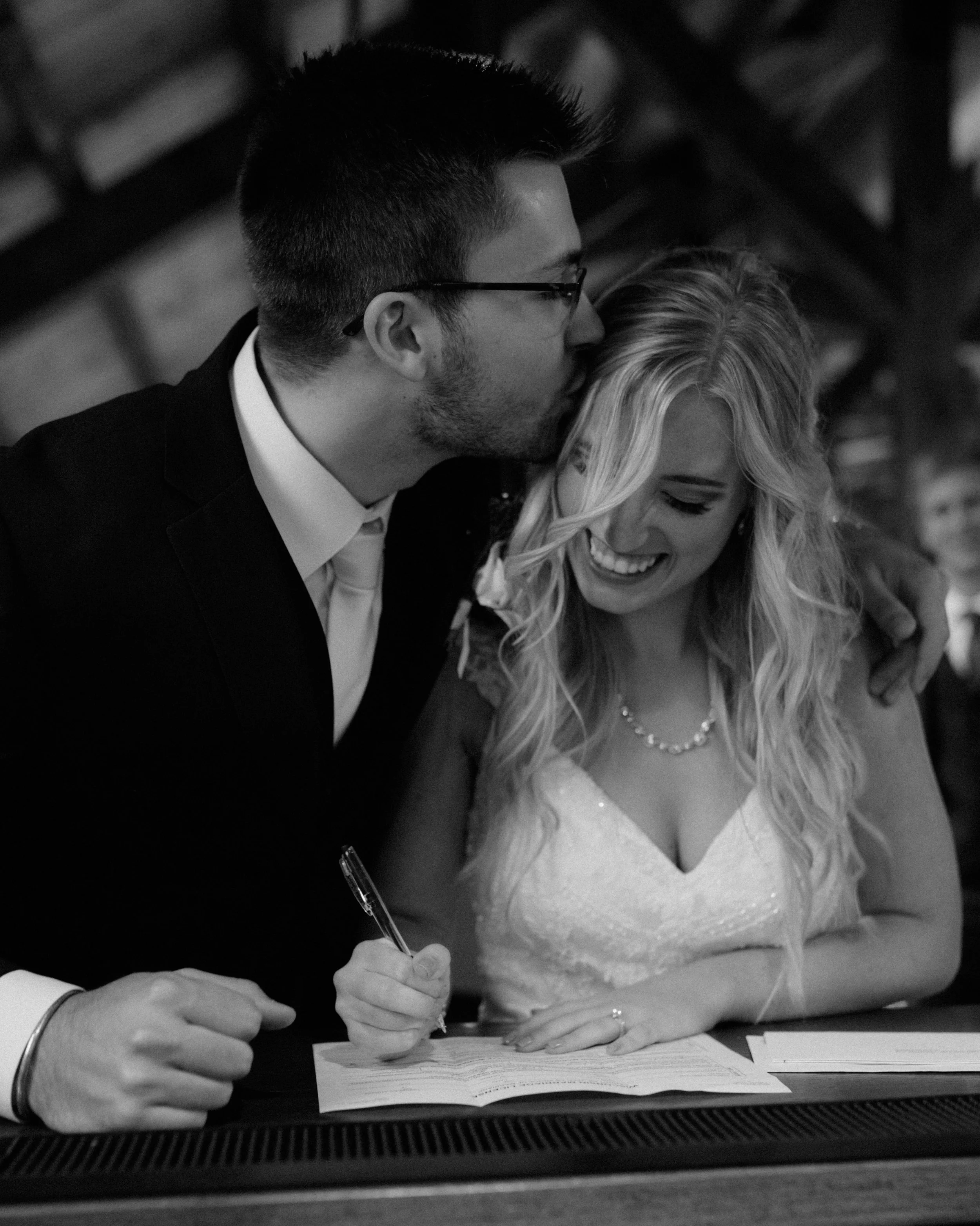 Bride & groom signing their marriage license full of joy at Barn at the Bog Fall Wedding Saukville WI