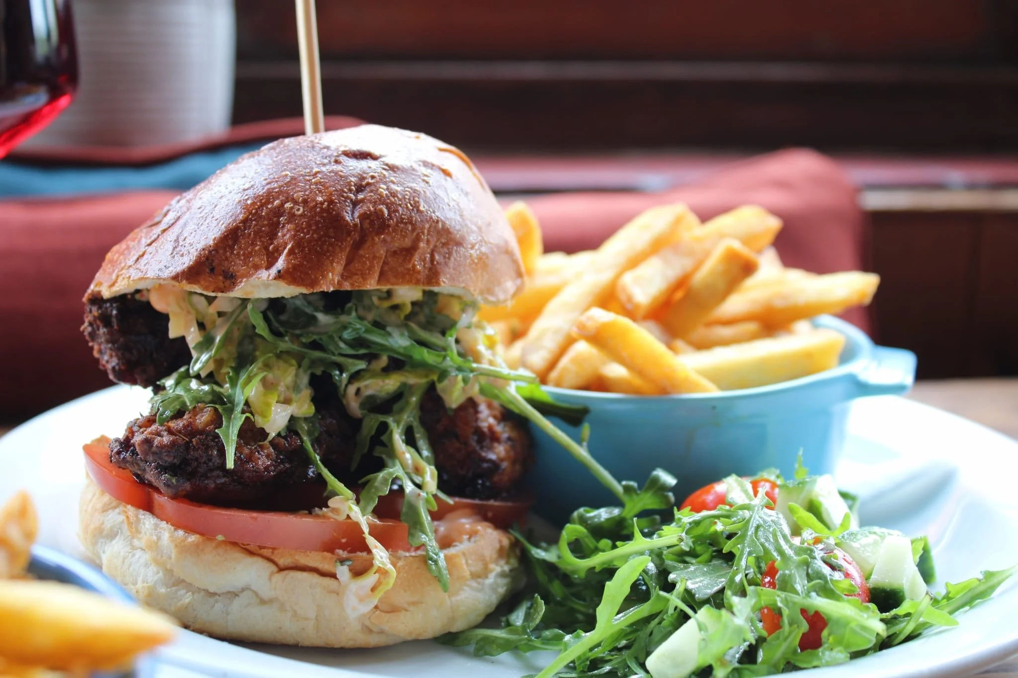 Seasonal dishes including a gourmet pub burger with fries and fresh salad