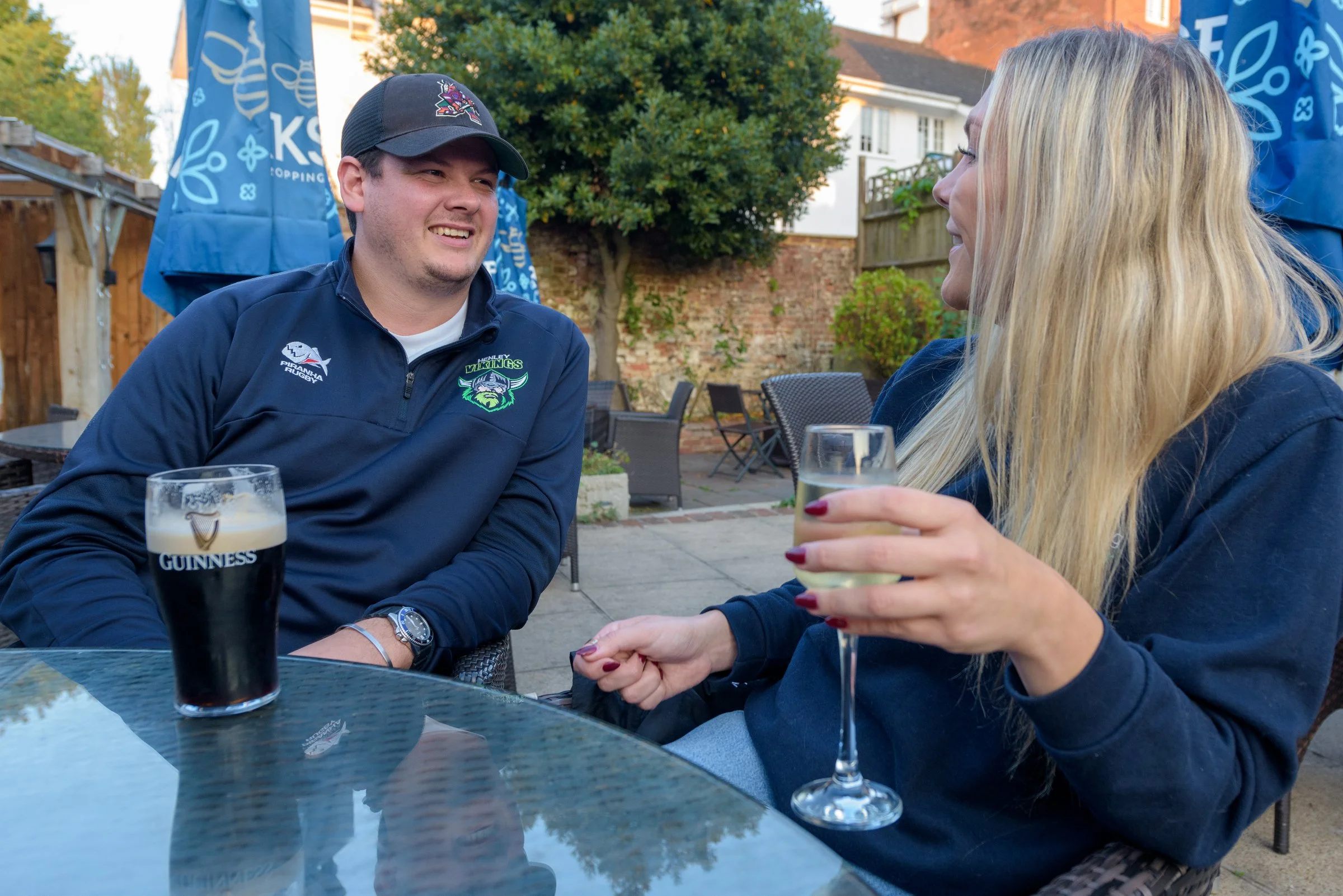 Guests enjoying Guinness and wine outdoors while dining on seasonal dishes