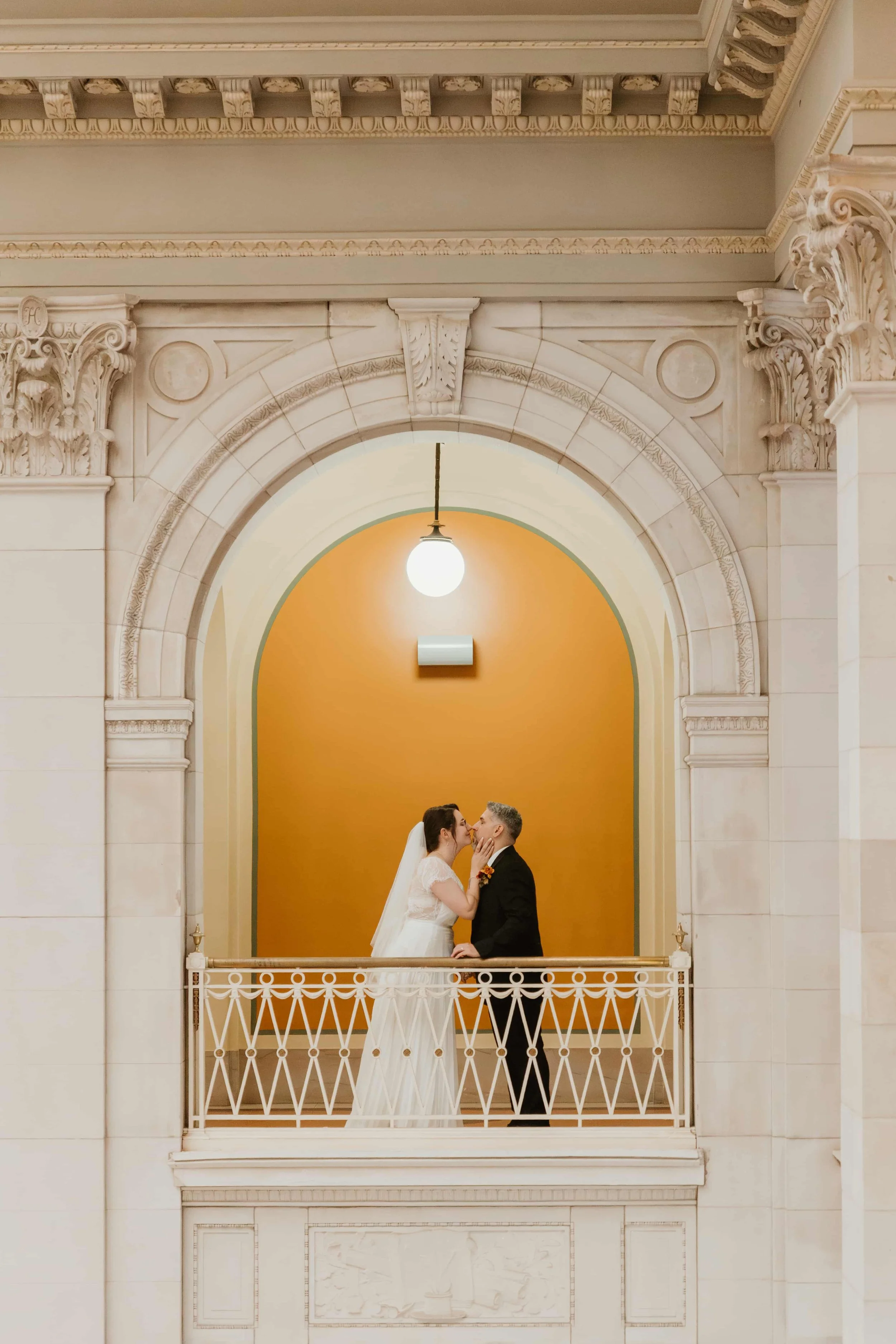 Bride and groon kissing in Hartford city hall CT