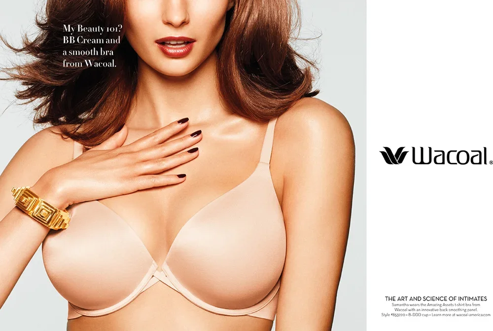 A woman with shoulder-length brown hair, wearing beige bra and gold bracelet, touching her chest with her left hand. The Wacoal logo is on the right side of the image, and there is text about BB cream and a smooth bra from Wacoal.
