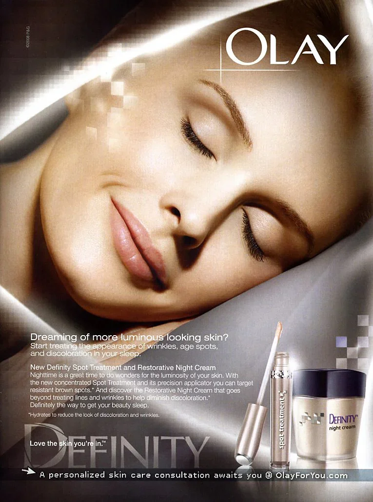Close-up of a woman with smooth, glowing skin and closed eyes, promoting Olay skincare products for treating wrinkles, age spots, and discoloration, featuring night cream and spot treatment.