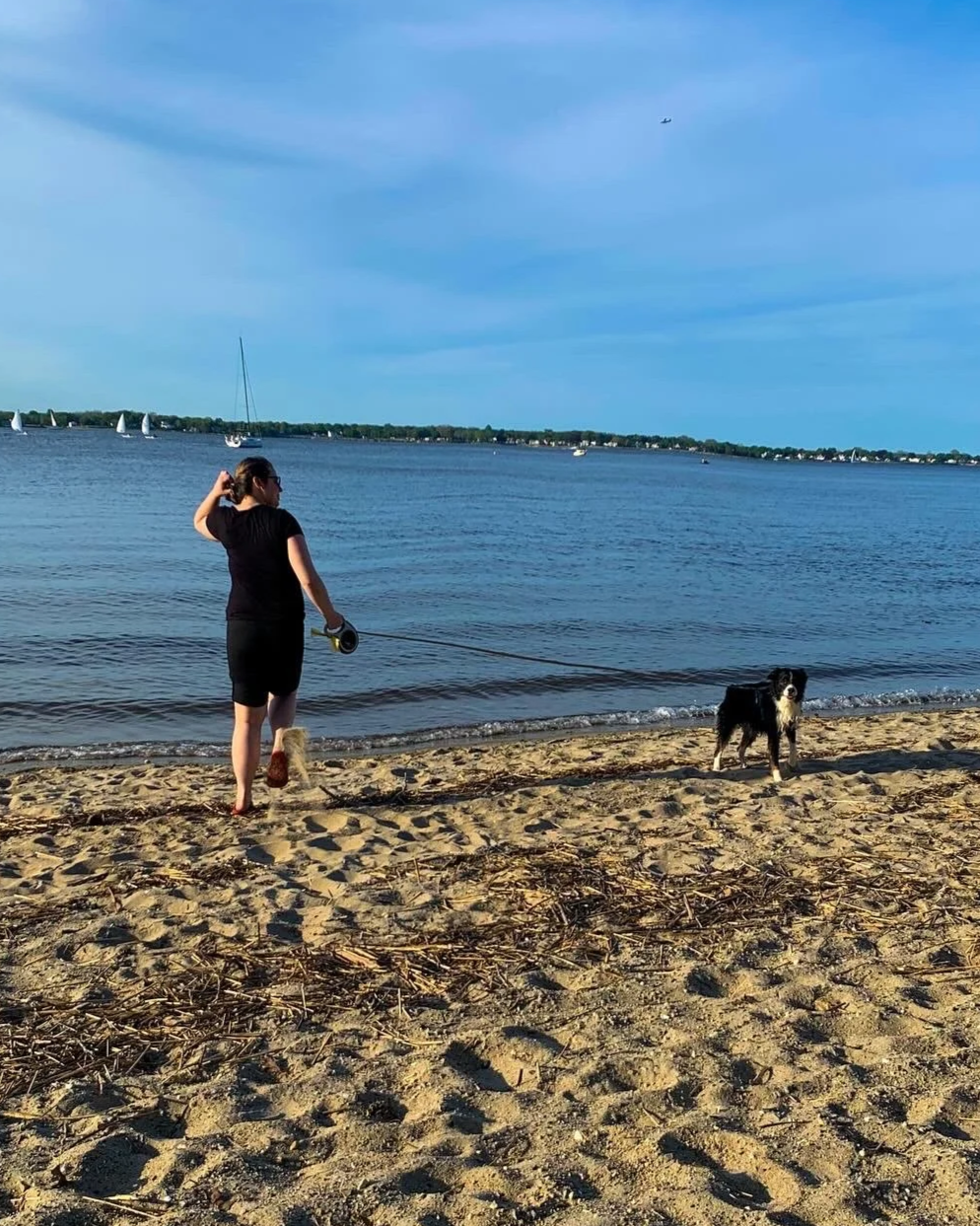 Therapist at the beach with her dog