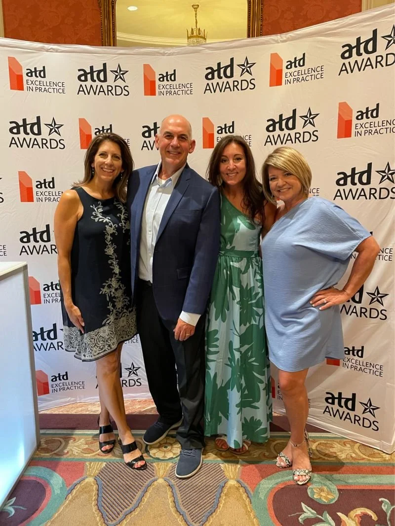 People getting an award for Learning and talent development