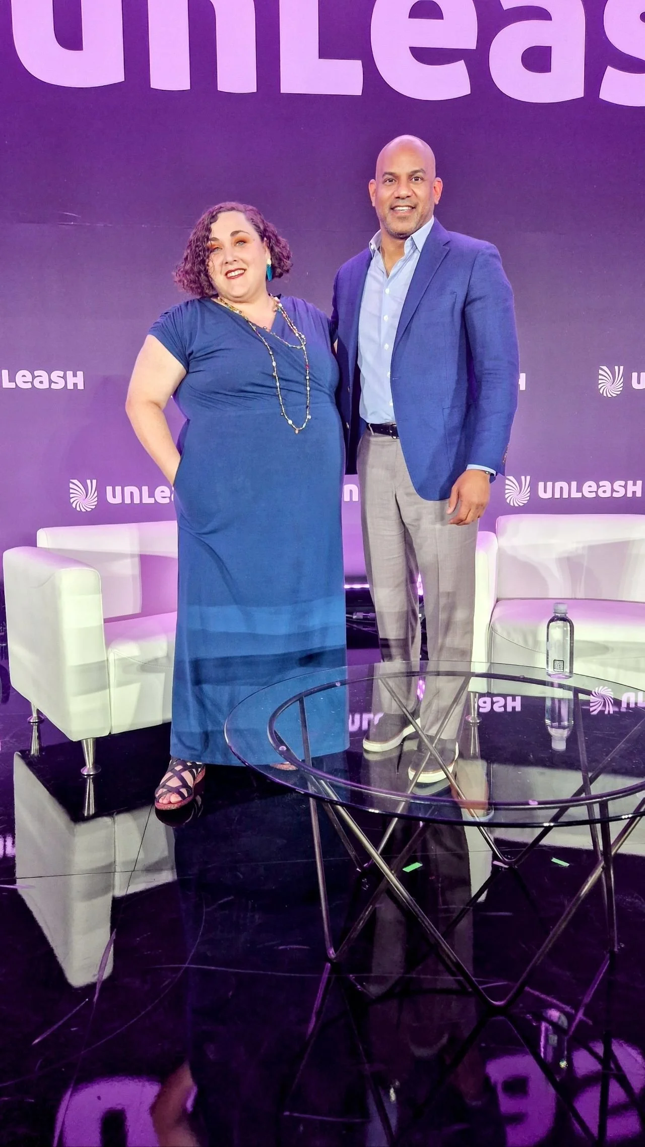 Two people celebrate the success of an event after being coached by Maie crumpton