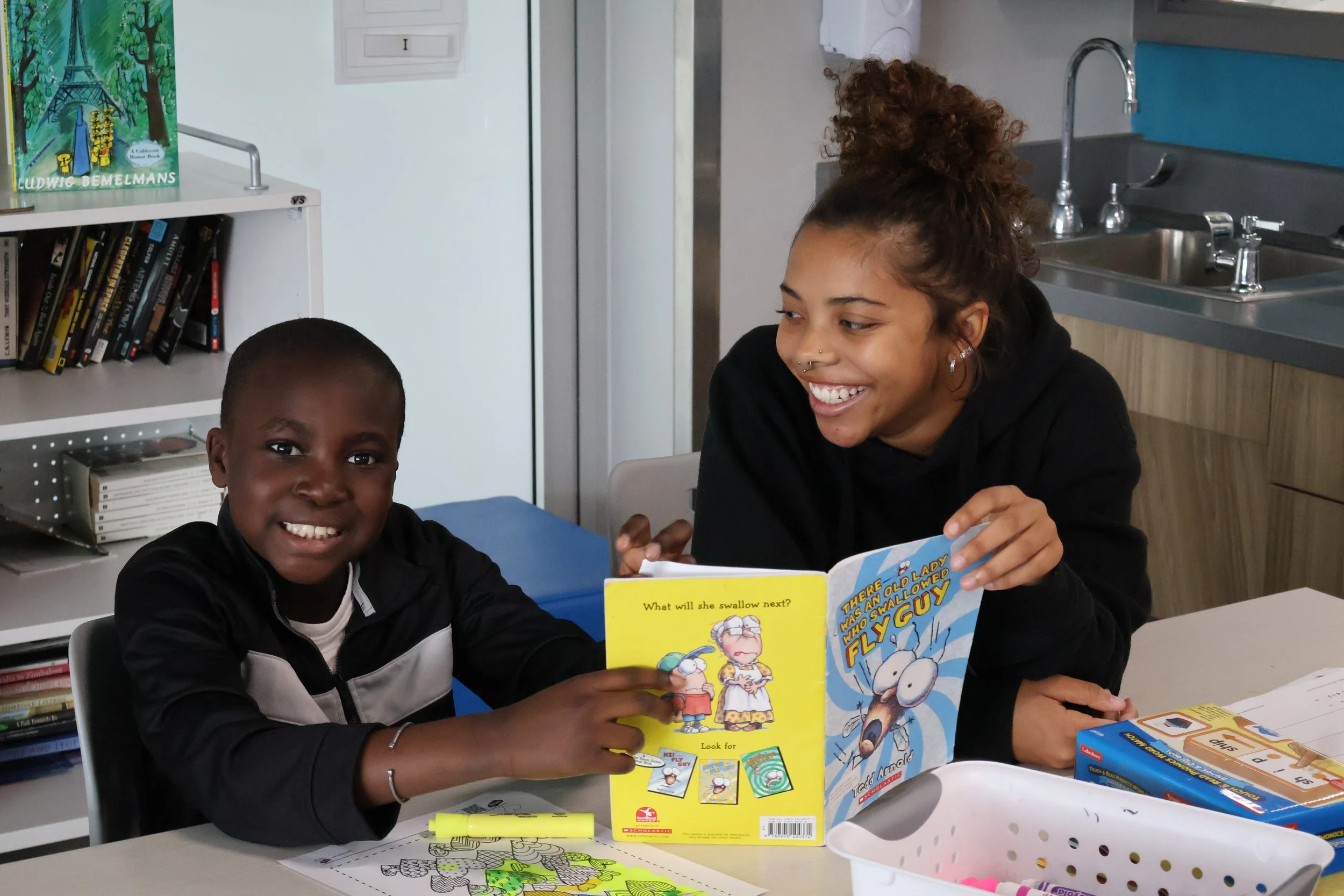 Root2Rise-MV_Bryanna Smiles with Fly Guy.JPG