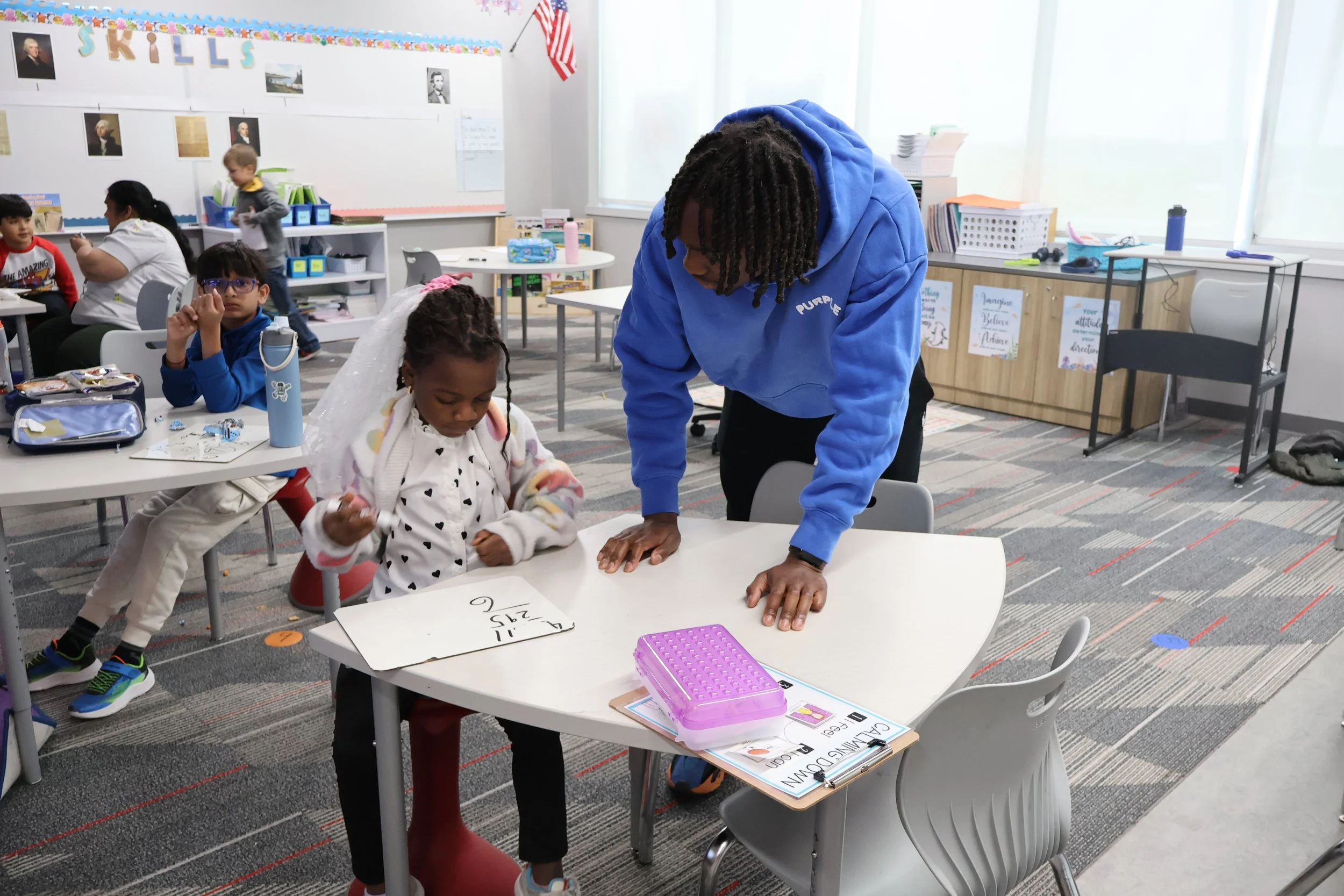 Root2Rise-MV_Joc Helps Girl.JPG