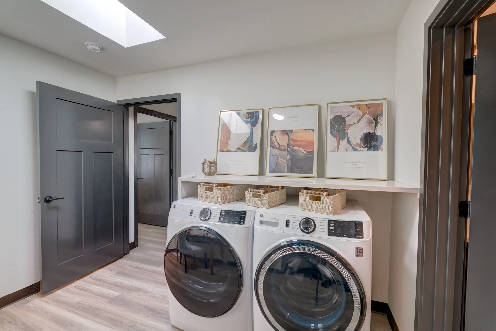 Accessible front-load washer and dryer for easier reach from a seated position