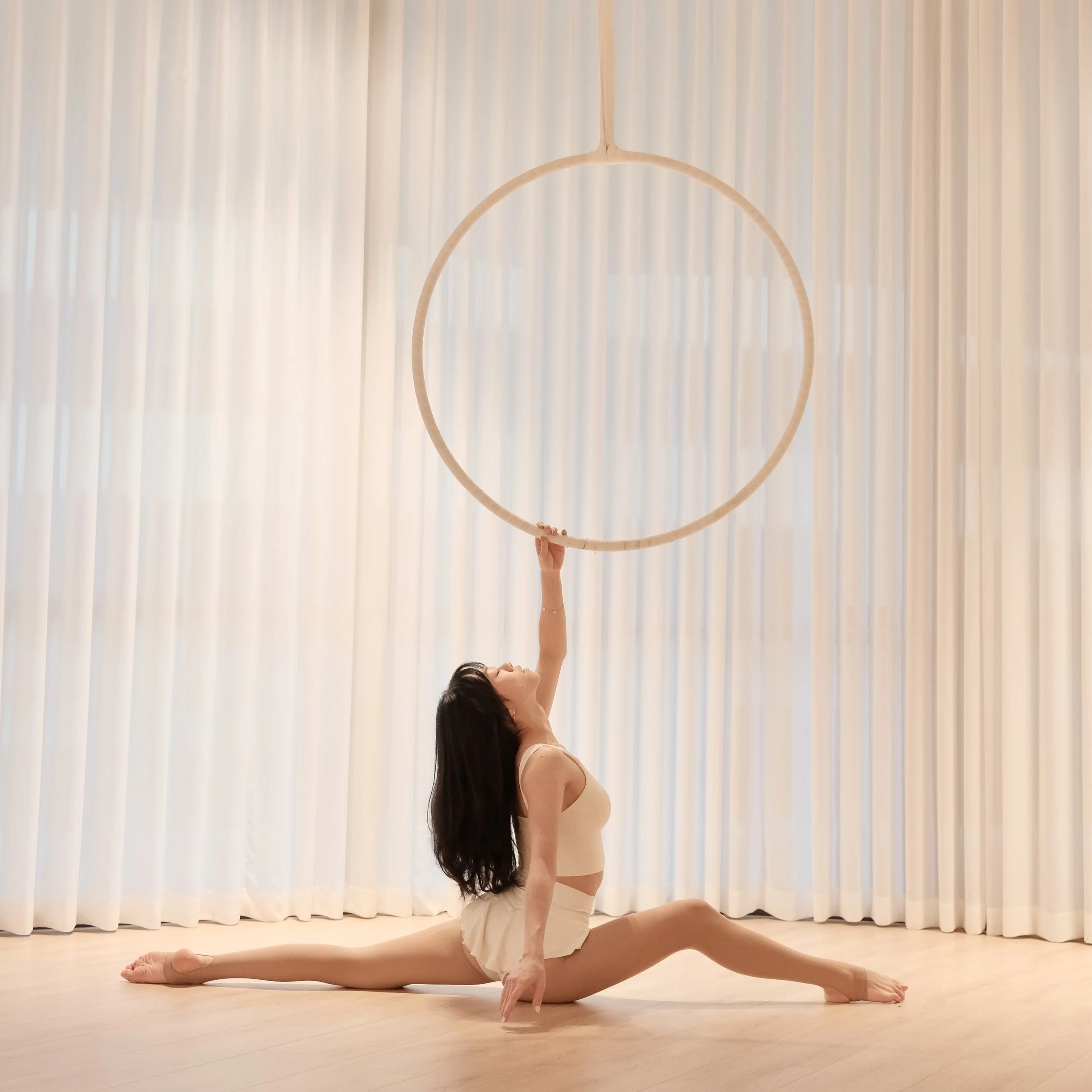 Clean aerial hoop training space in Melbourne CBD with soft tones and a calm studio environment