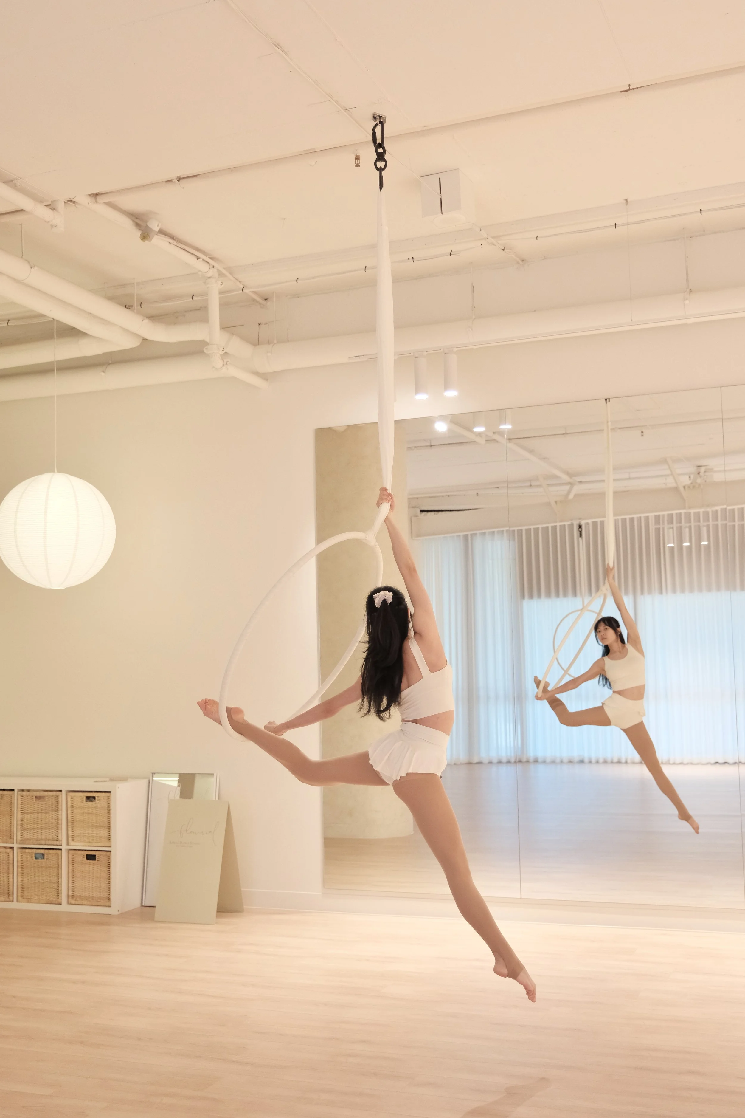 Aerial hoop and hammock studio in Melbourne CBD with soft fabrics, minimal design, and a calm, spacious environment.