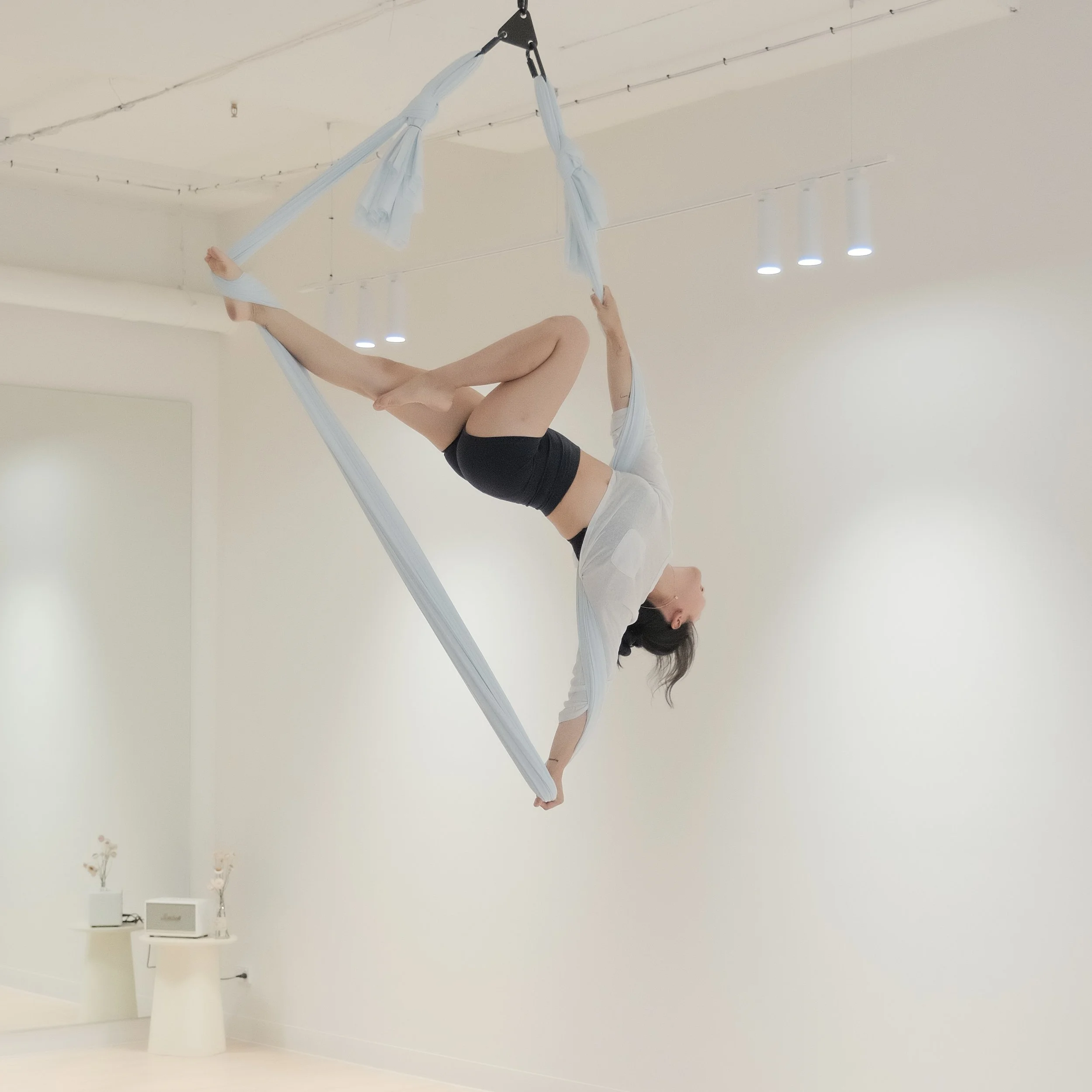 Aerial hammock training area in Melbourne CBD, featuring soft fabrics and a clean, open studio environment.