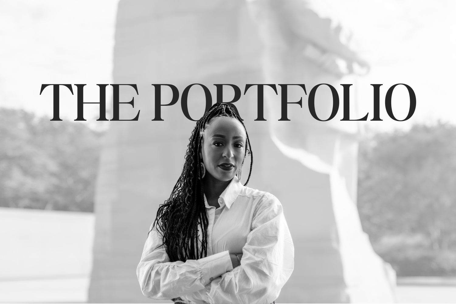 Black and white photo of a woman with long braided hair standing in front of a modern building, with the text 'THE PORTFOLIO' overlayed.
