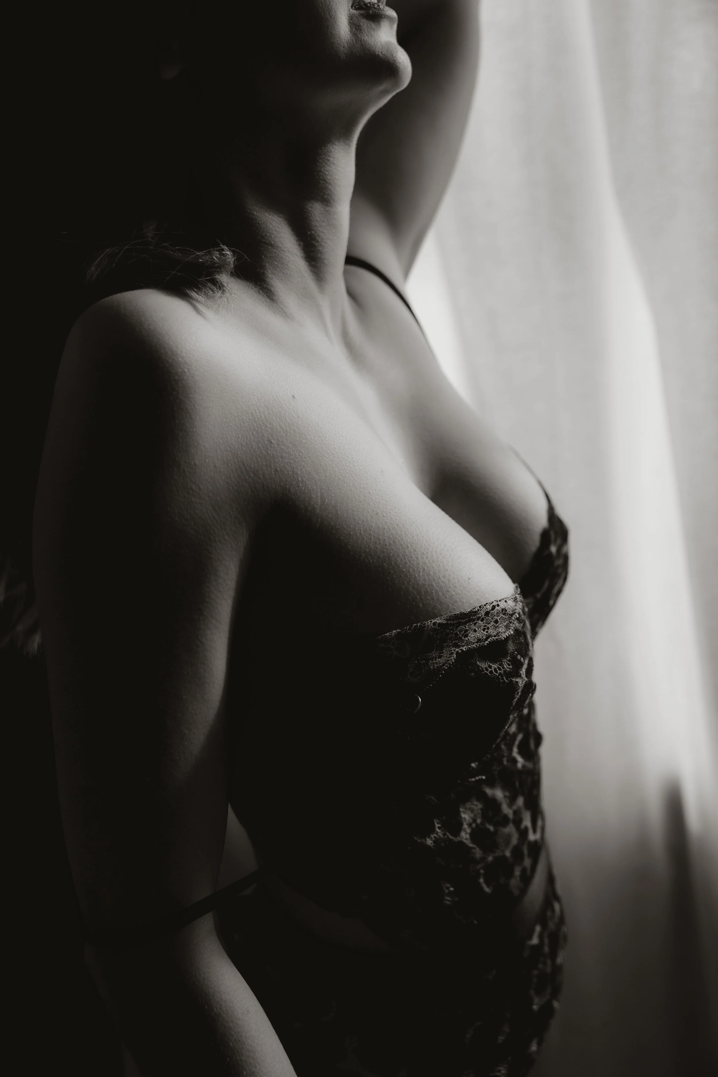Black and white image of a women in lingerie