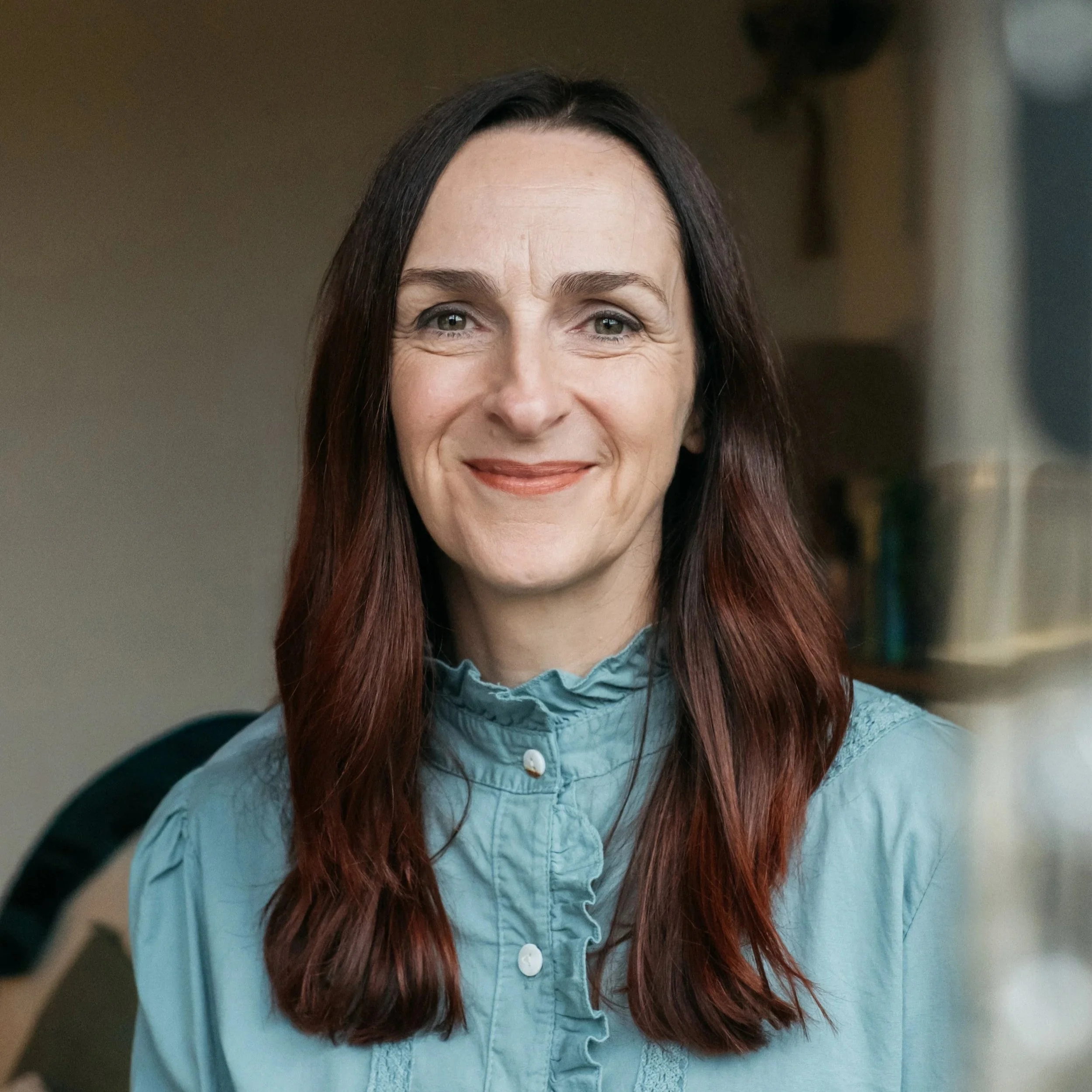 Maeve Manogue smiling in her office