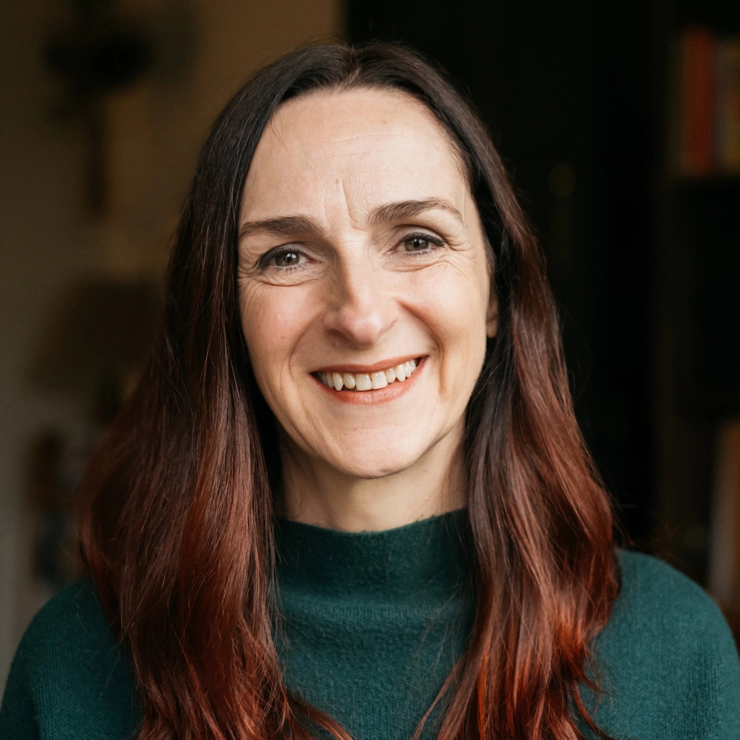 Maeve Manogue smiling in her office