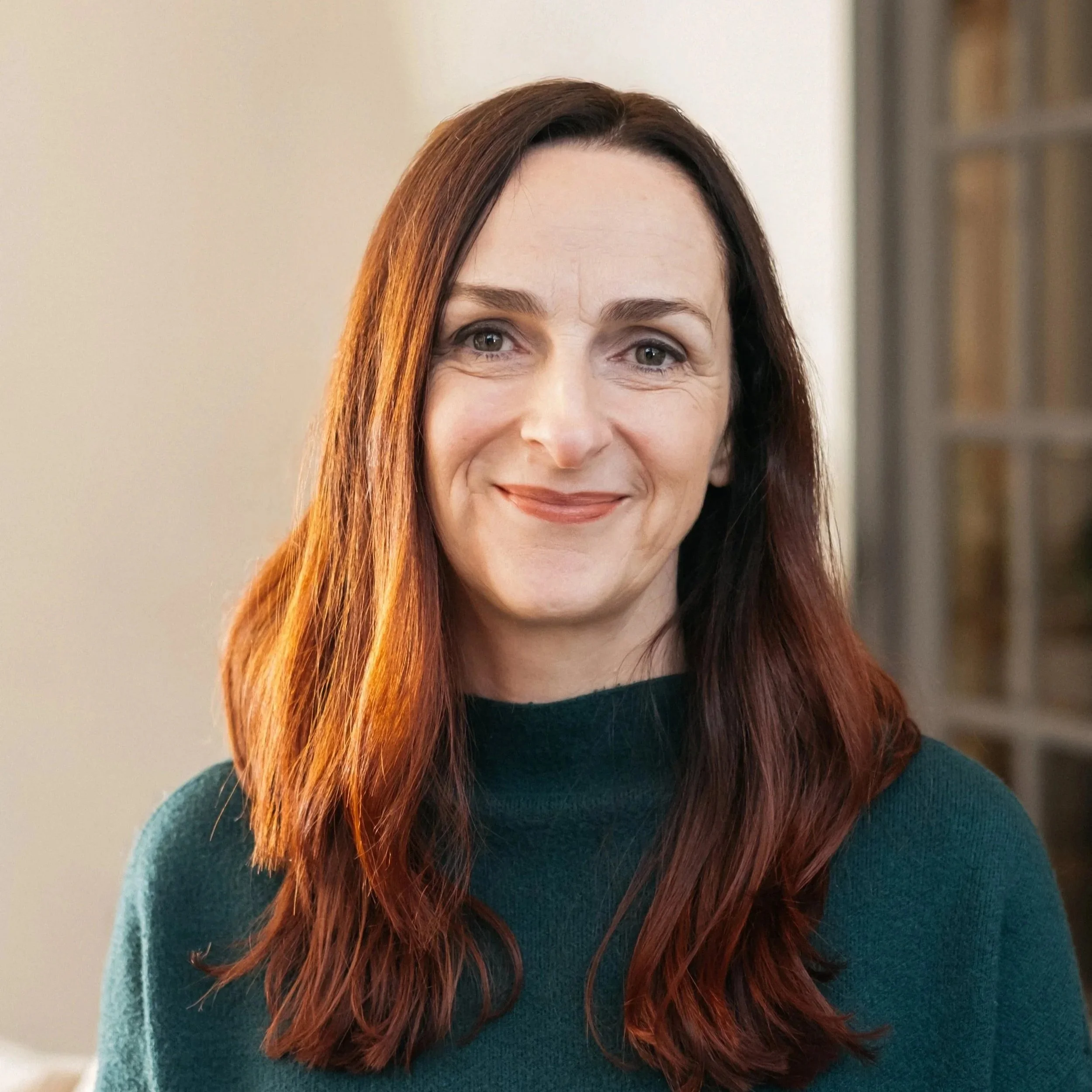 Maeve Manogue smiling in her office