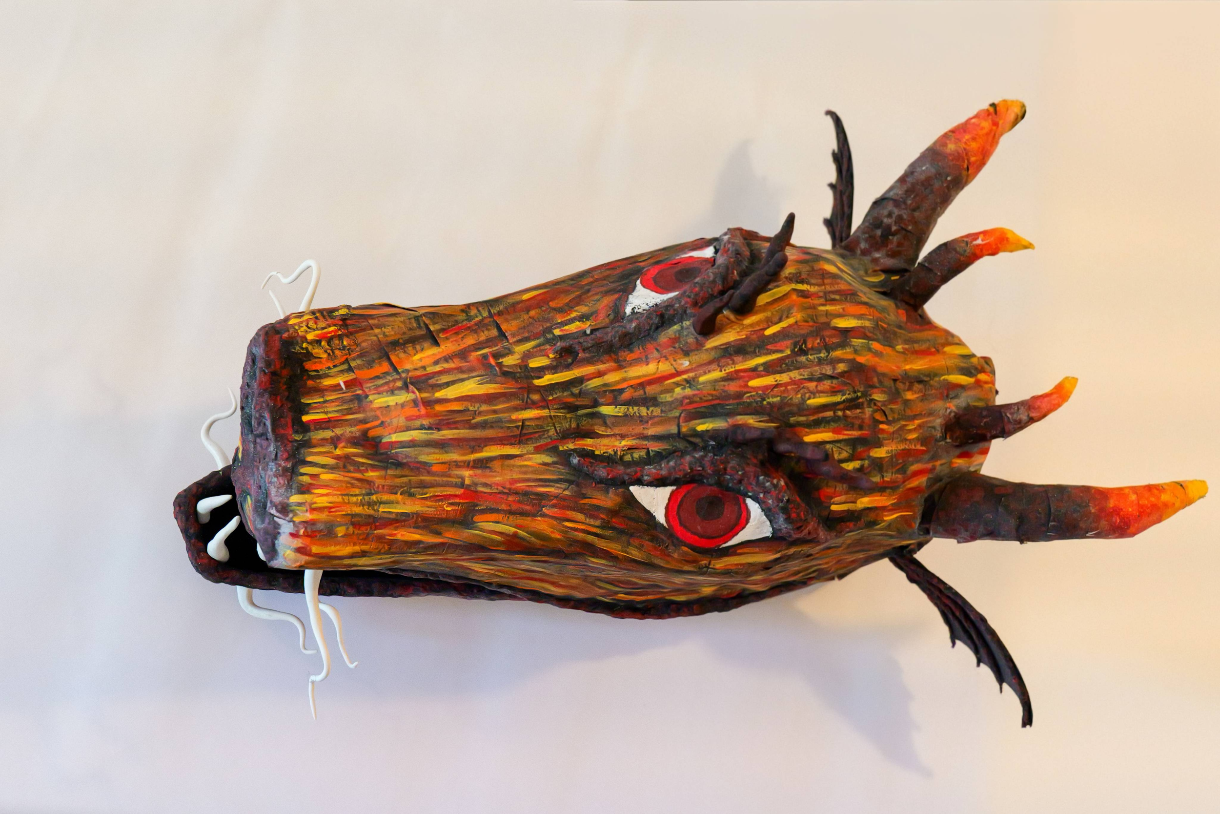 Fully functional Dragon Head mask made out of Papier Mache and painted with acrylic paint. 