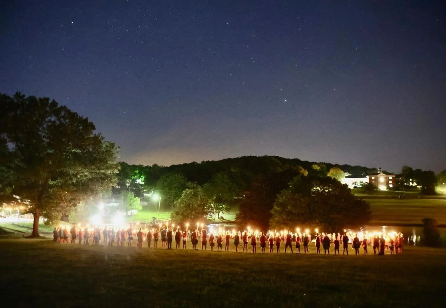 A picture of a candlelight outdoor event for youth at Camp Massenetta