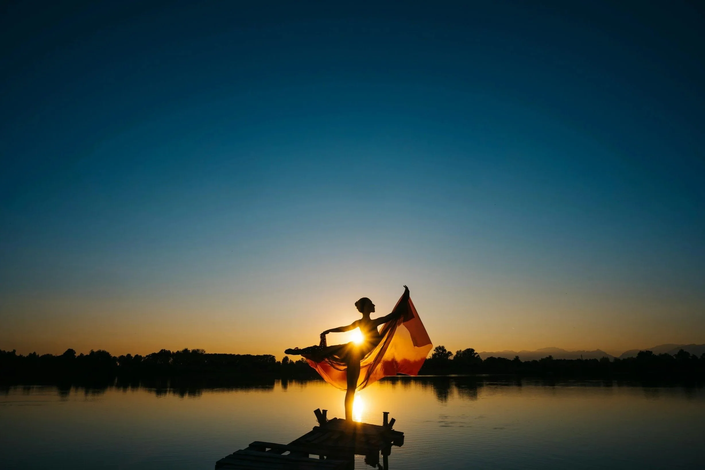 silhouette of dancer on water