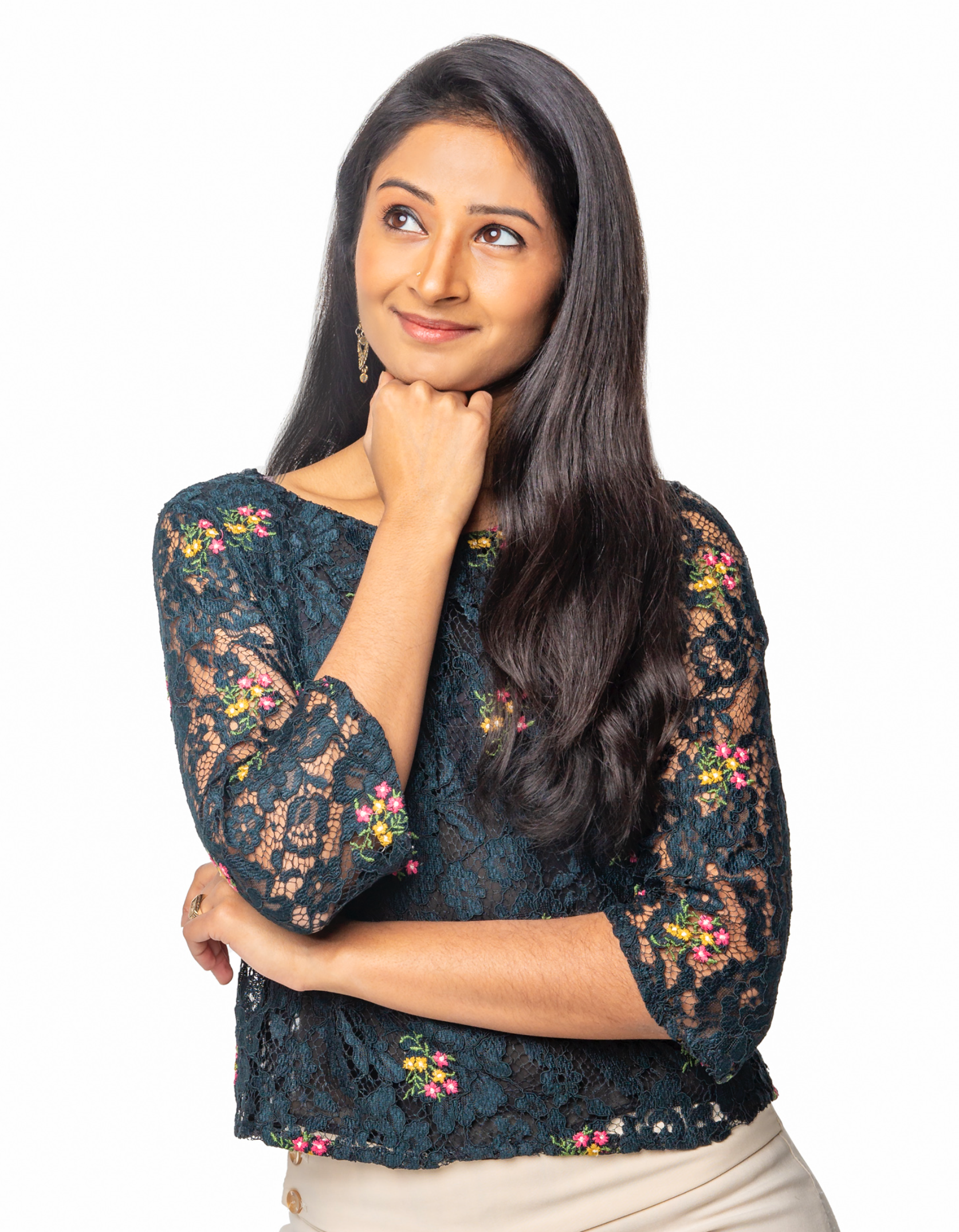 Professional headshot of a woman photographed on a white background with a thoughtful expression.