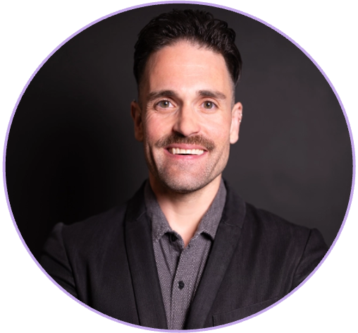 Portrait of a smiling man with dark hair, wearing a dark blazer and a gray shirt, against a black background with a purple circular border.