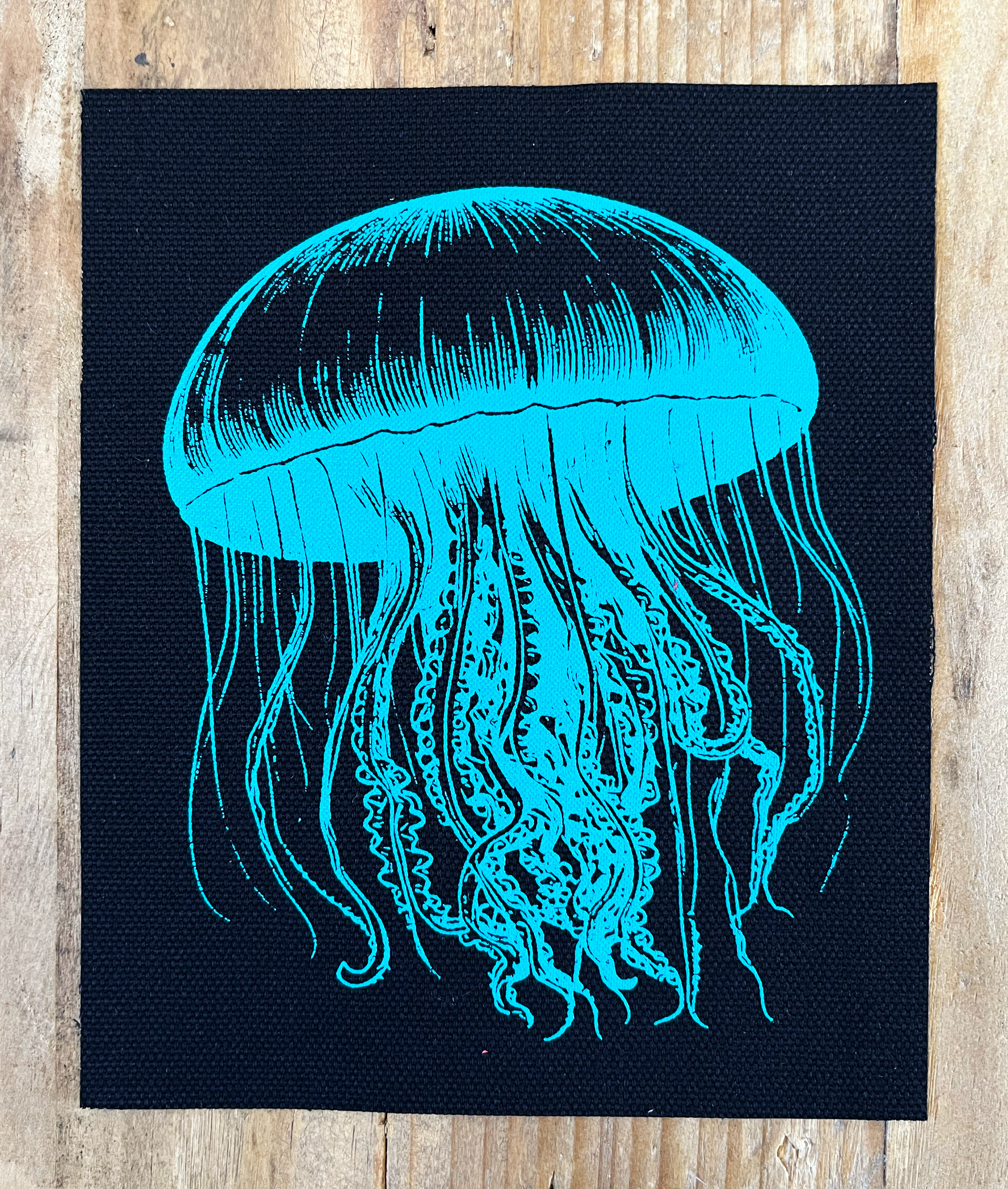 Jellyfish Small Patch Teal on Black.png