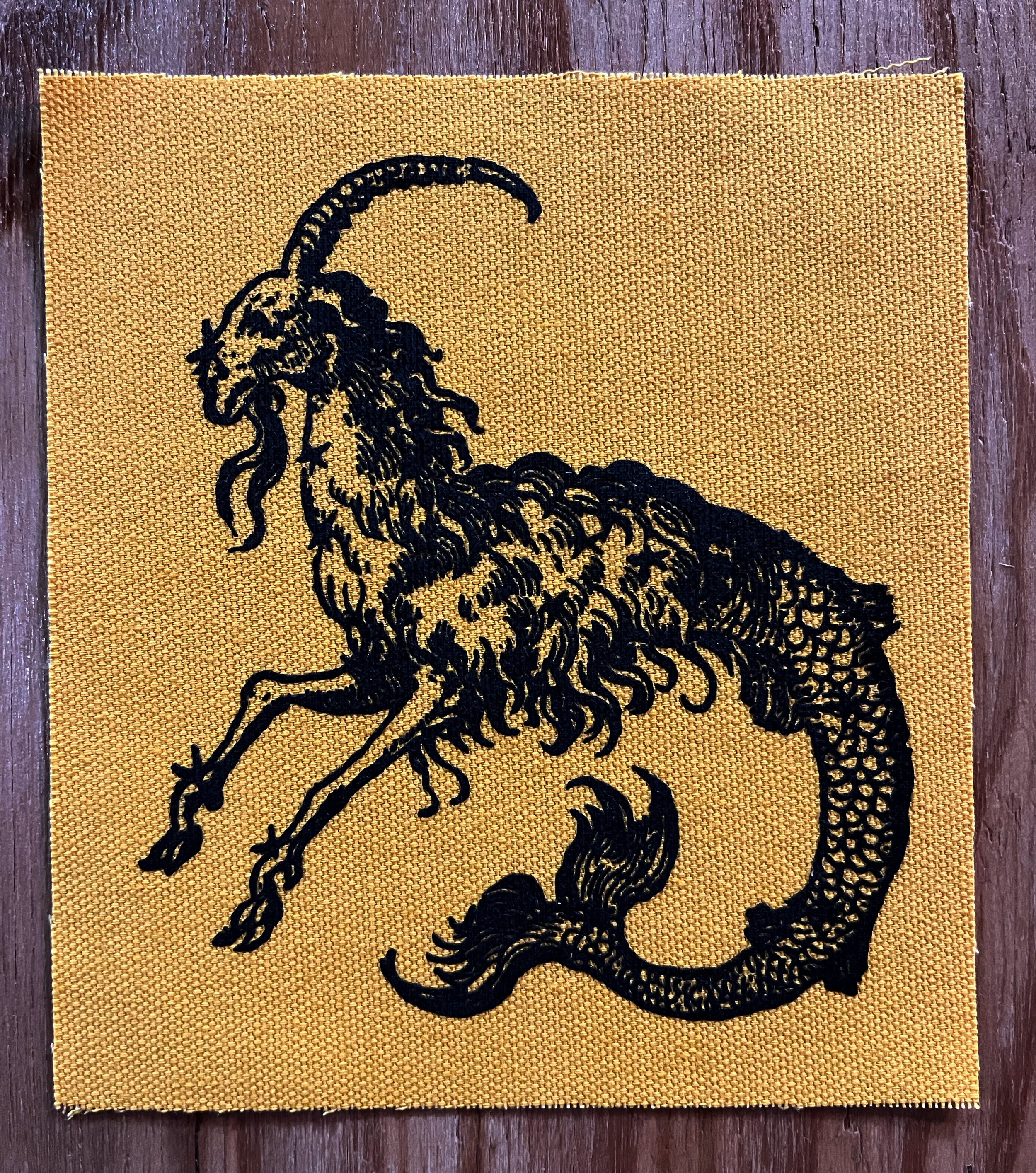 Mergoat Small Patch Black on Yellow.png