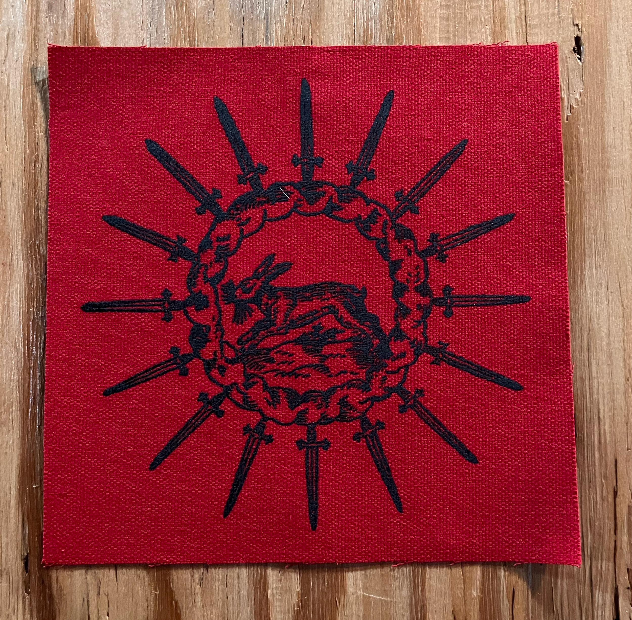 Rabbit Circle Small Patch Black on Red.png