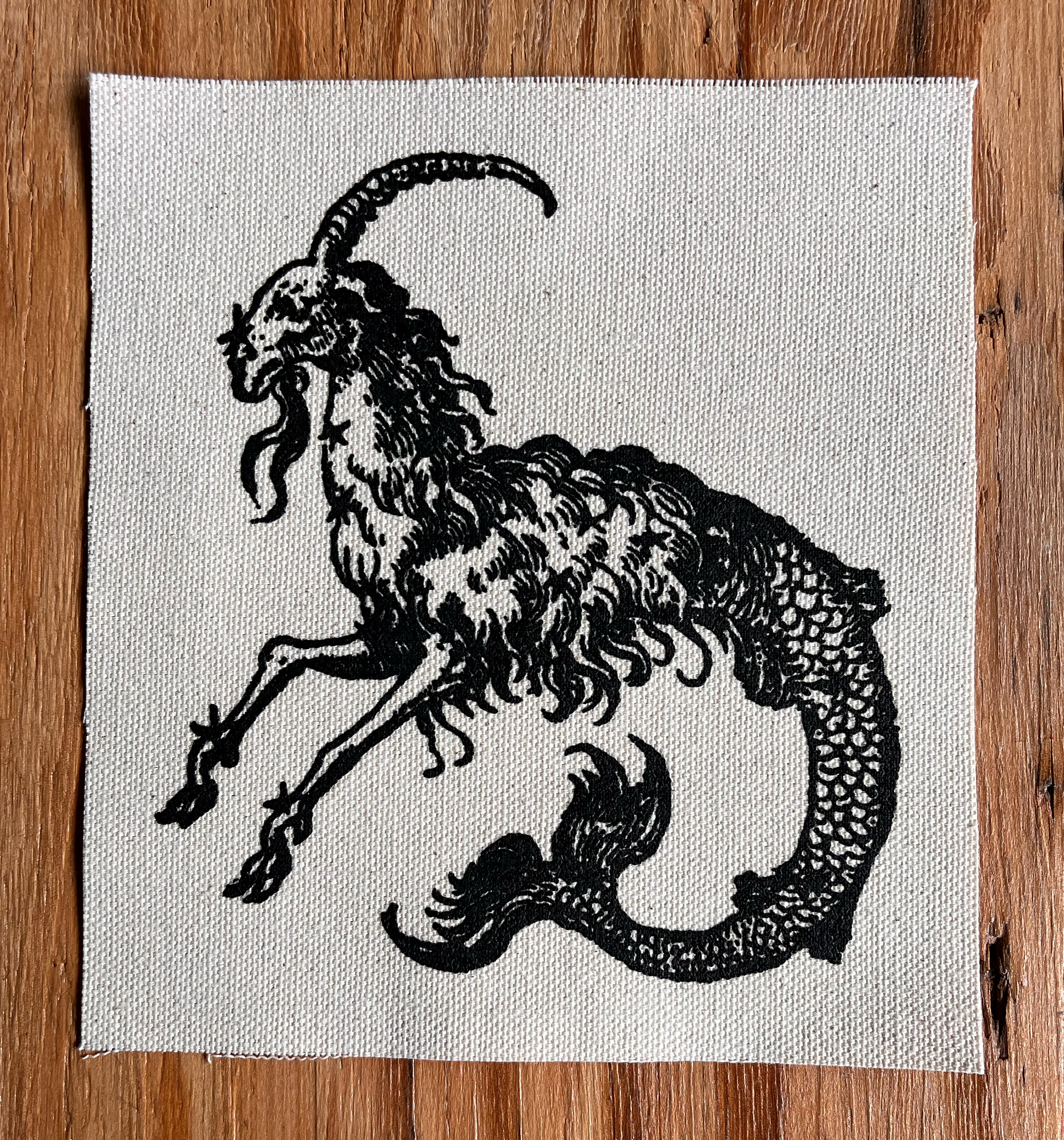 Mergoat Small Patch Black on Natural.png