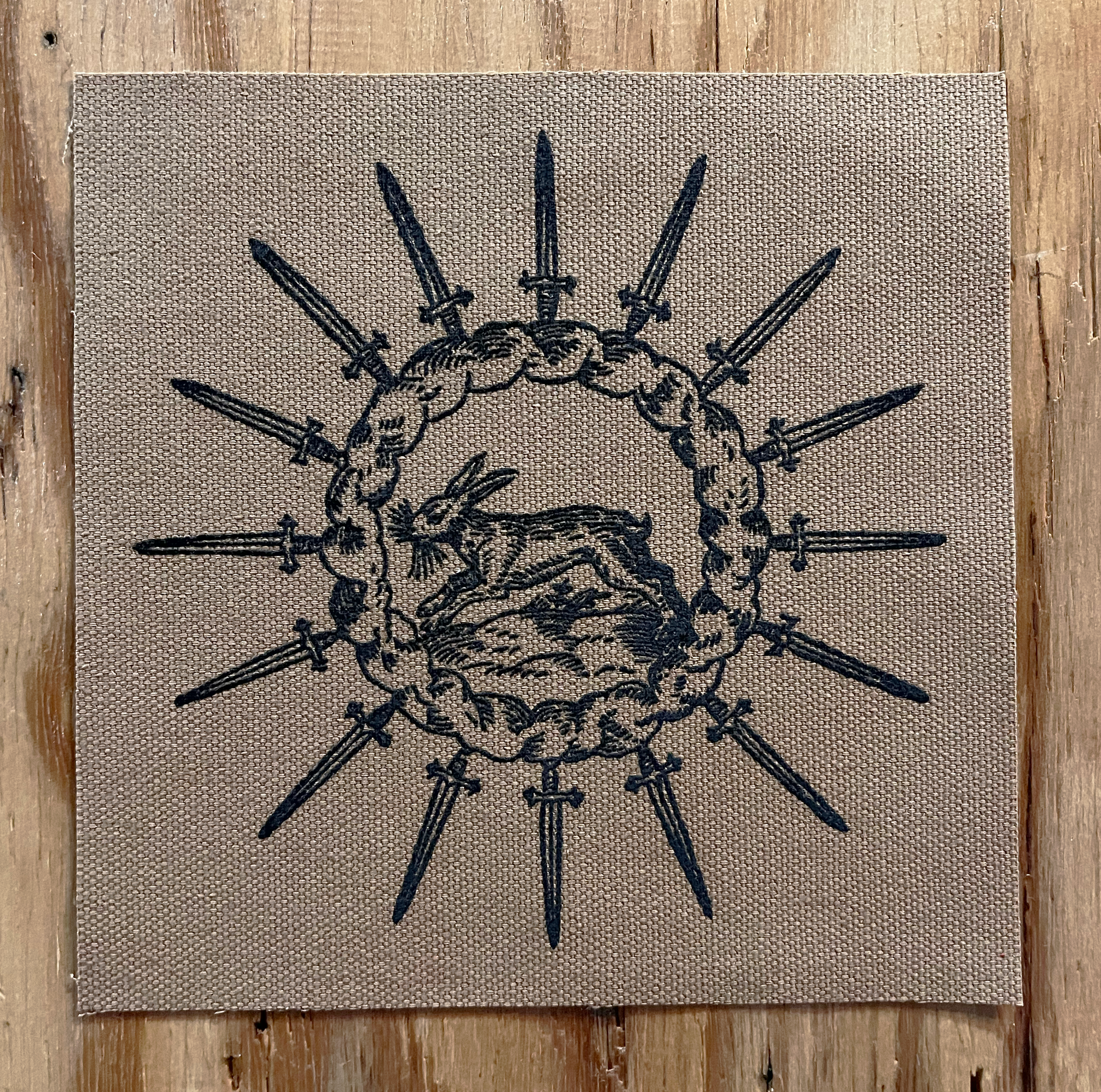 Rabbit Circle Small Patch Black on Light Brown.png