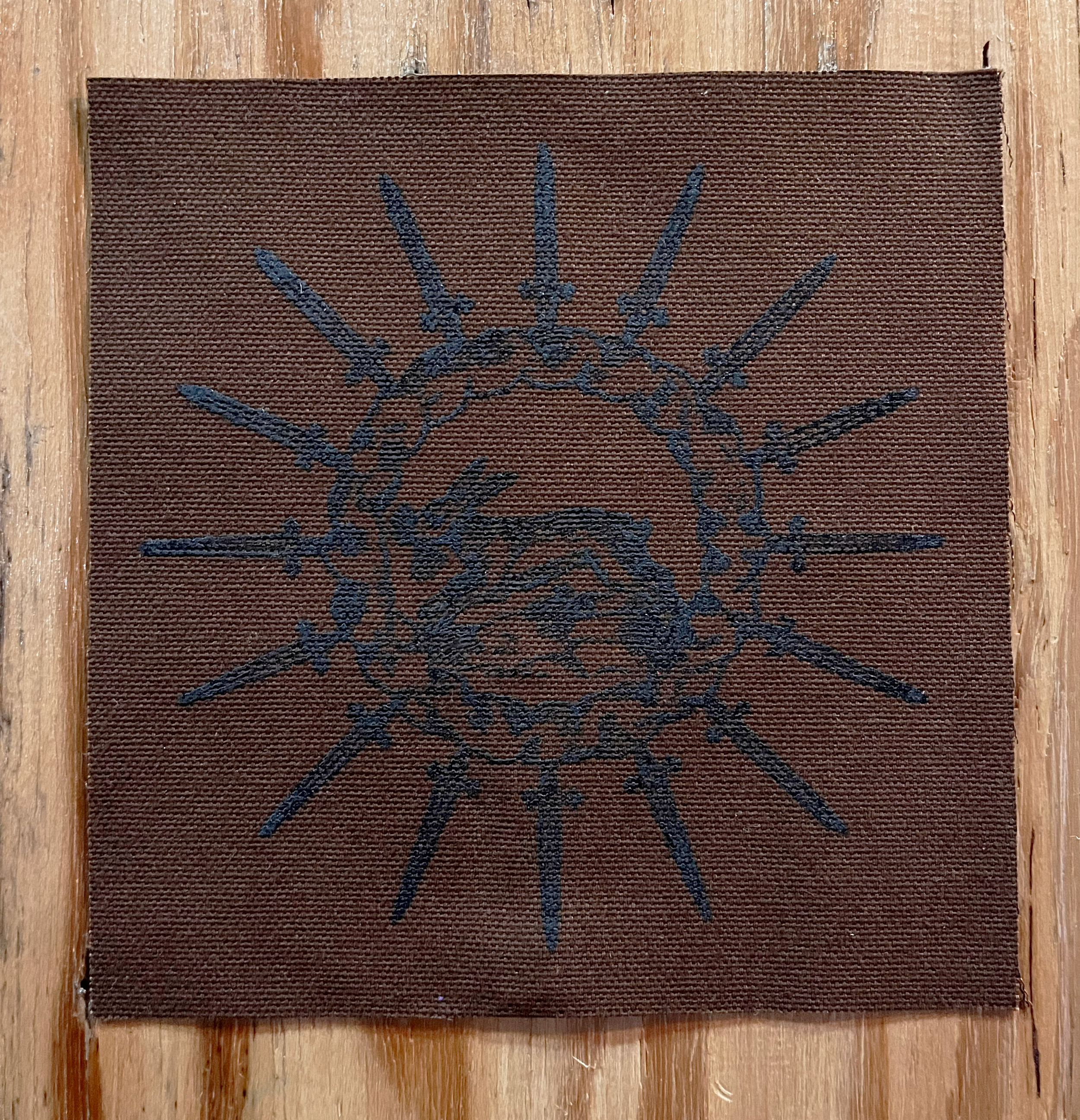 Rabbit Circle Small Patch Black on Dark Brown.png