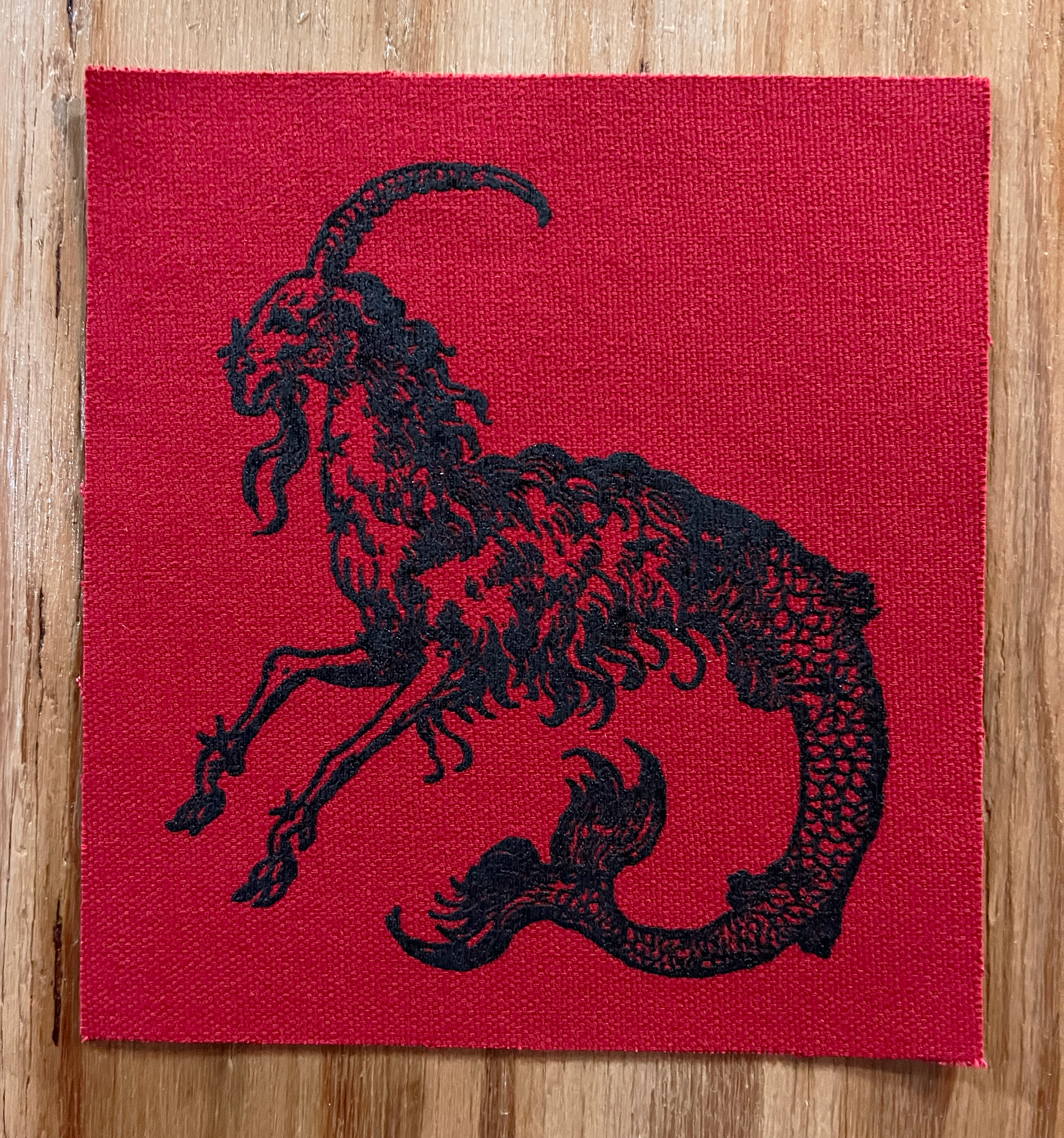 Mergoat Small Patch Black on Red.png
