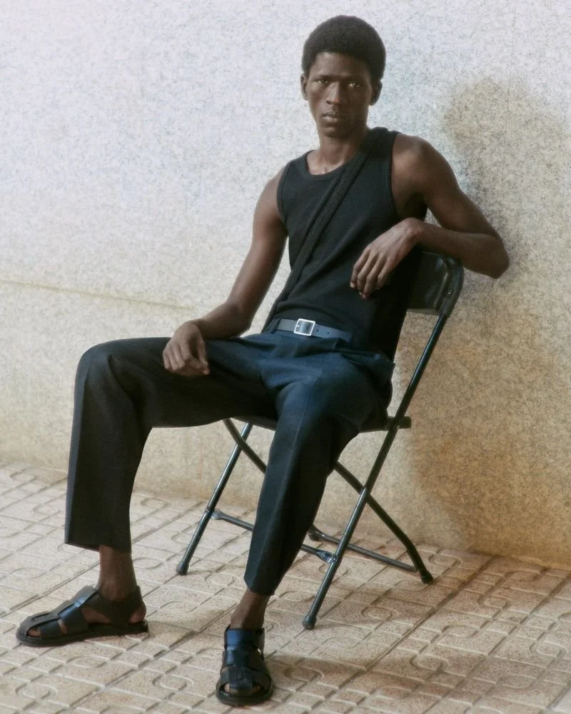 Moustapha Sy by Daniel Shea for COS Summer 2023 Ad Campaign. Hair Stylist: Ryan Mitchell. Makeup Artist: Siddhartha Simone. Art Director: Andy Knappett