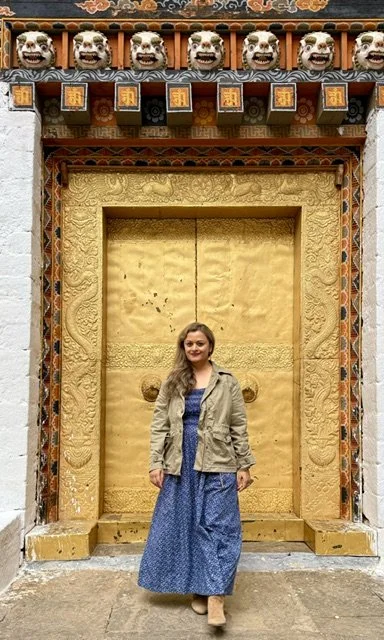Paro Zhong in Bhutan. standing in front of a gold door