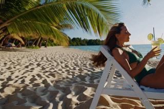 Relaxed OnlyFans model on a tropical beach, creating lifestyle content for Fantera Agency’s portfolio. She is happy with the service of Onlyfans Agency, Fanvue Agency, Fansly Agency.