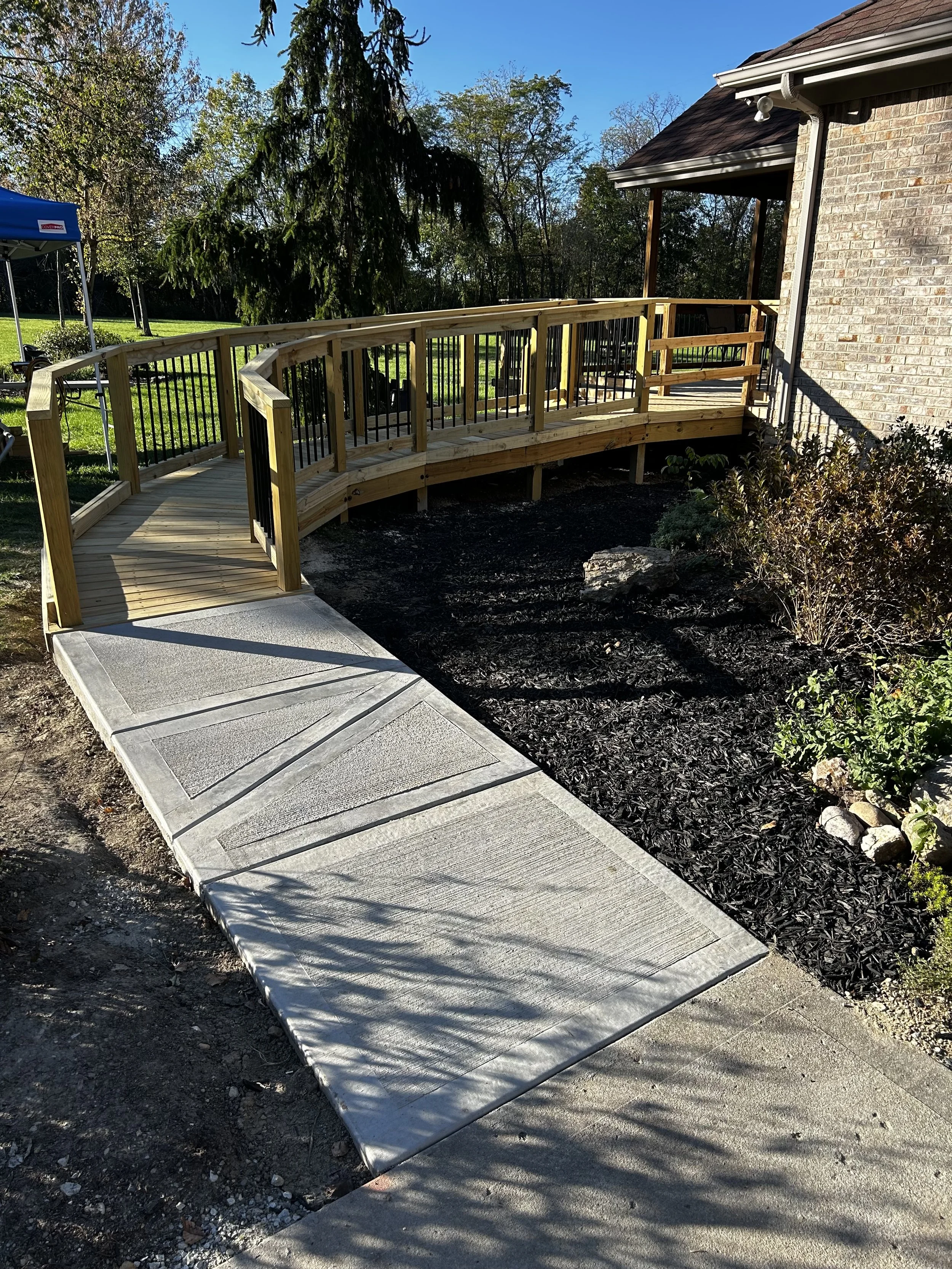 Ramp, ground-level composite deck, backyard deck with railings custom deck builder Ohio, low-maintenance outdoor living composite decking installation, wide-step deck design