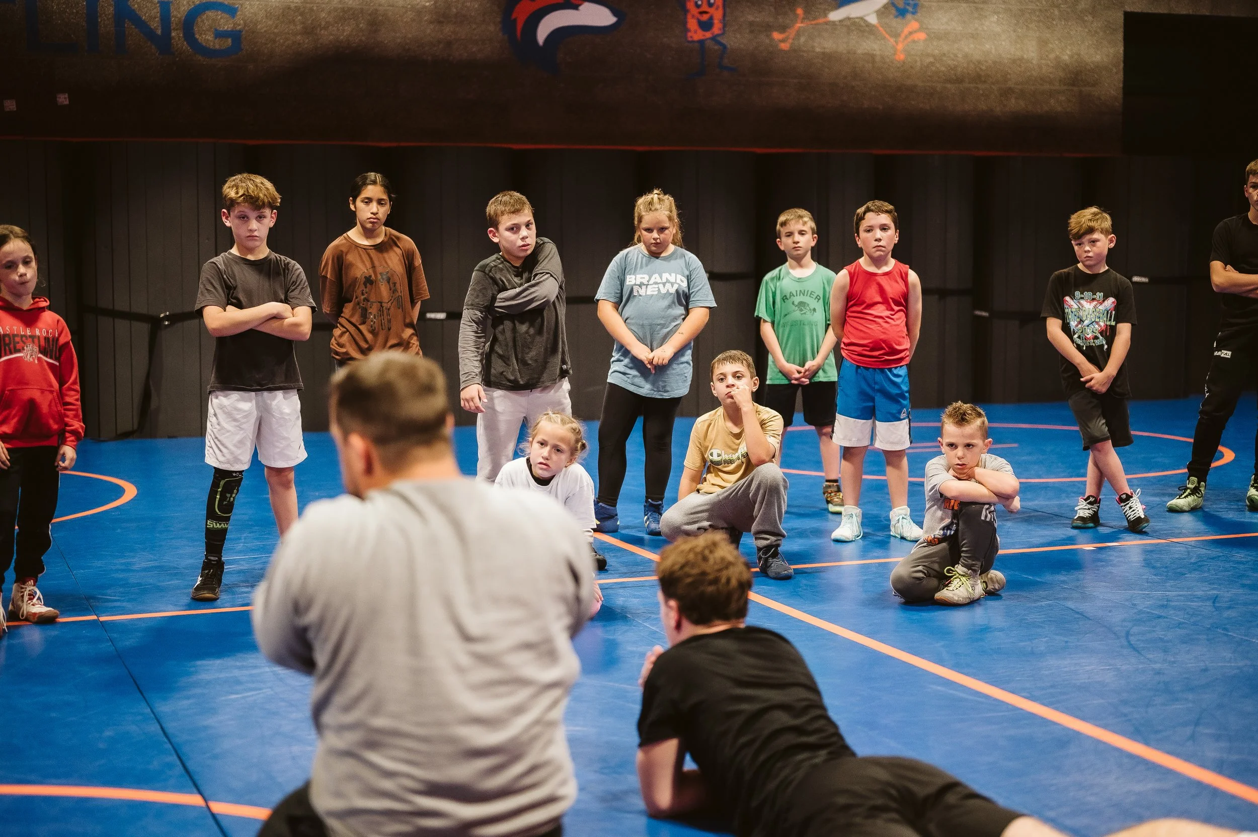 Young athlete playing soccer to improve footwork, coordination, and athletic development for wrestling