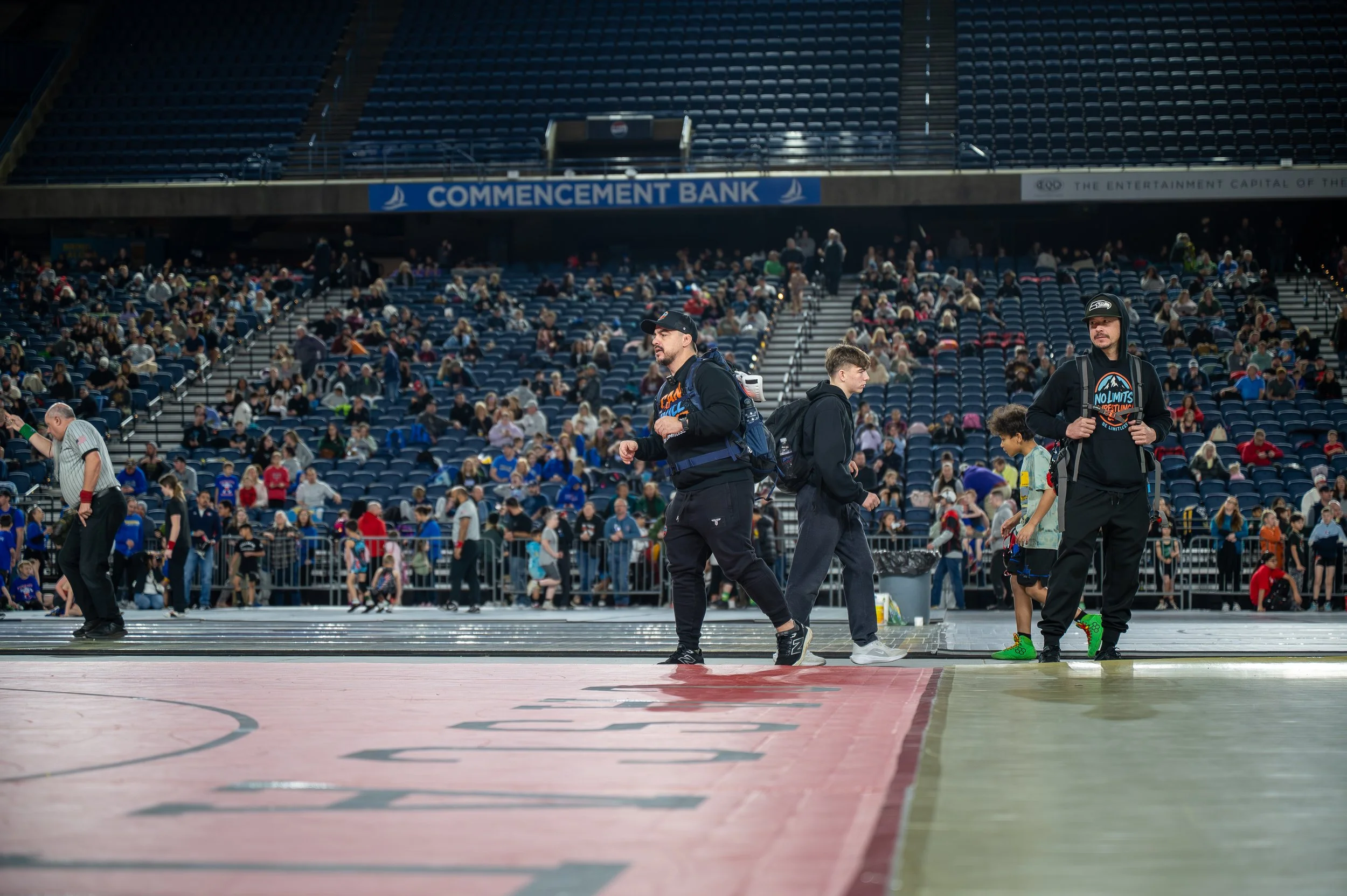 Wrestling coaches and athletes together at a tournament