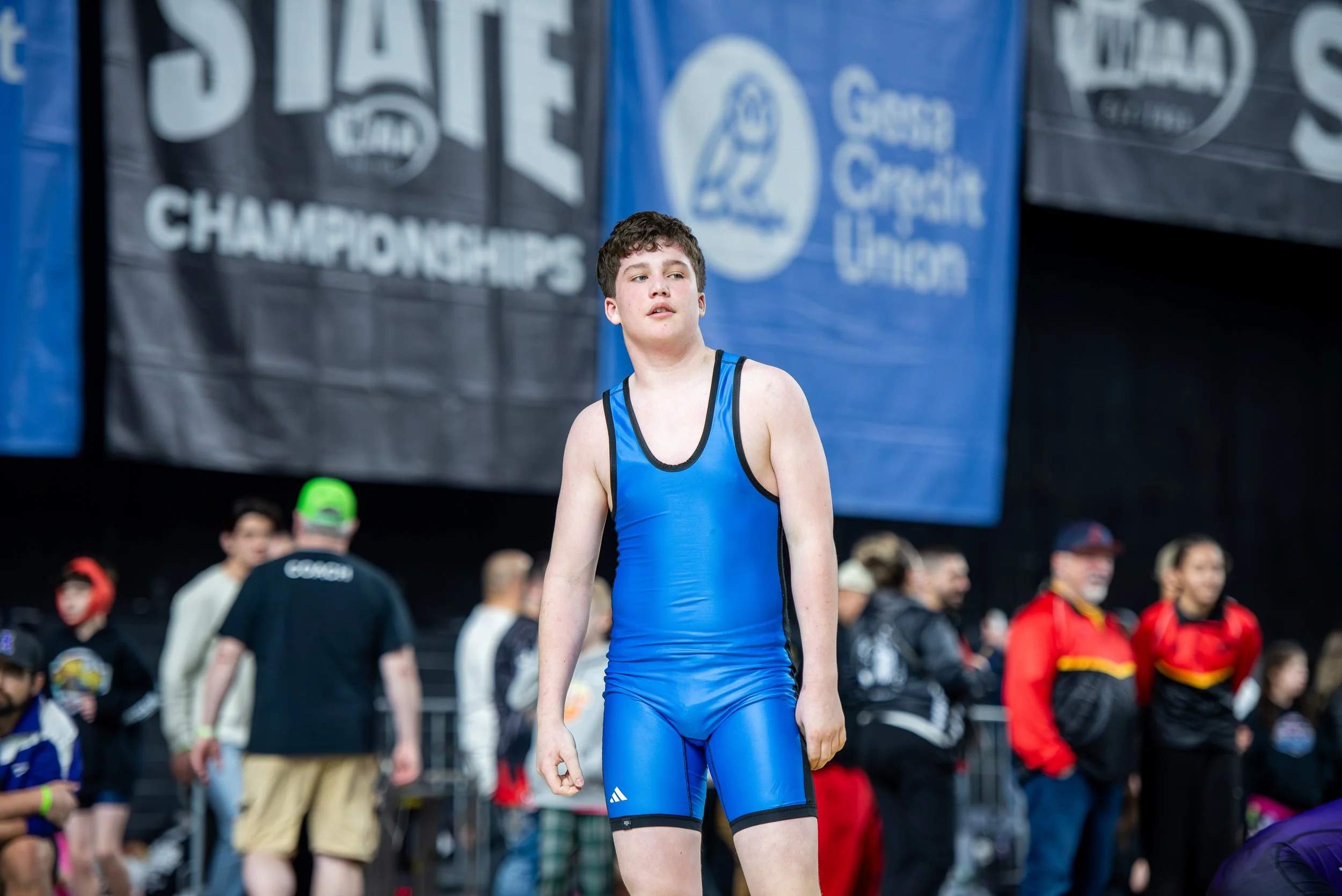 Youth wrestlers from No Limits Wrestling Club competing at the Tacoma Dome during Washington state championships