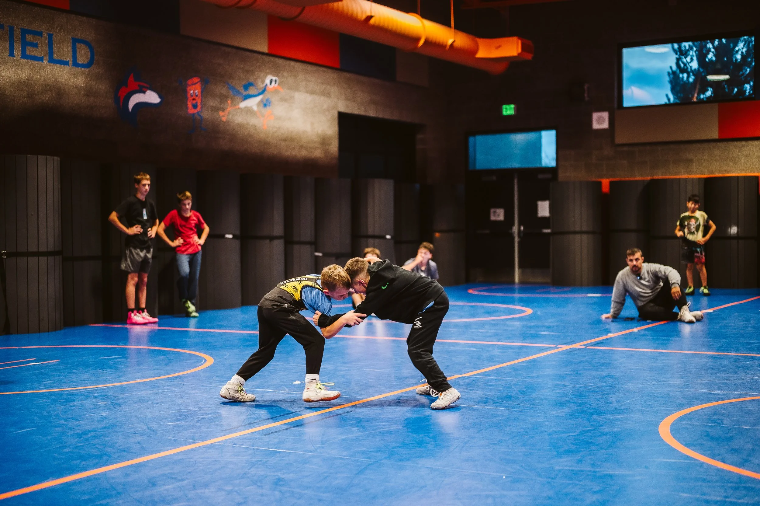 Youth wrestlers training during summer practice representing recovery, sleep habits, and offseason performance development
