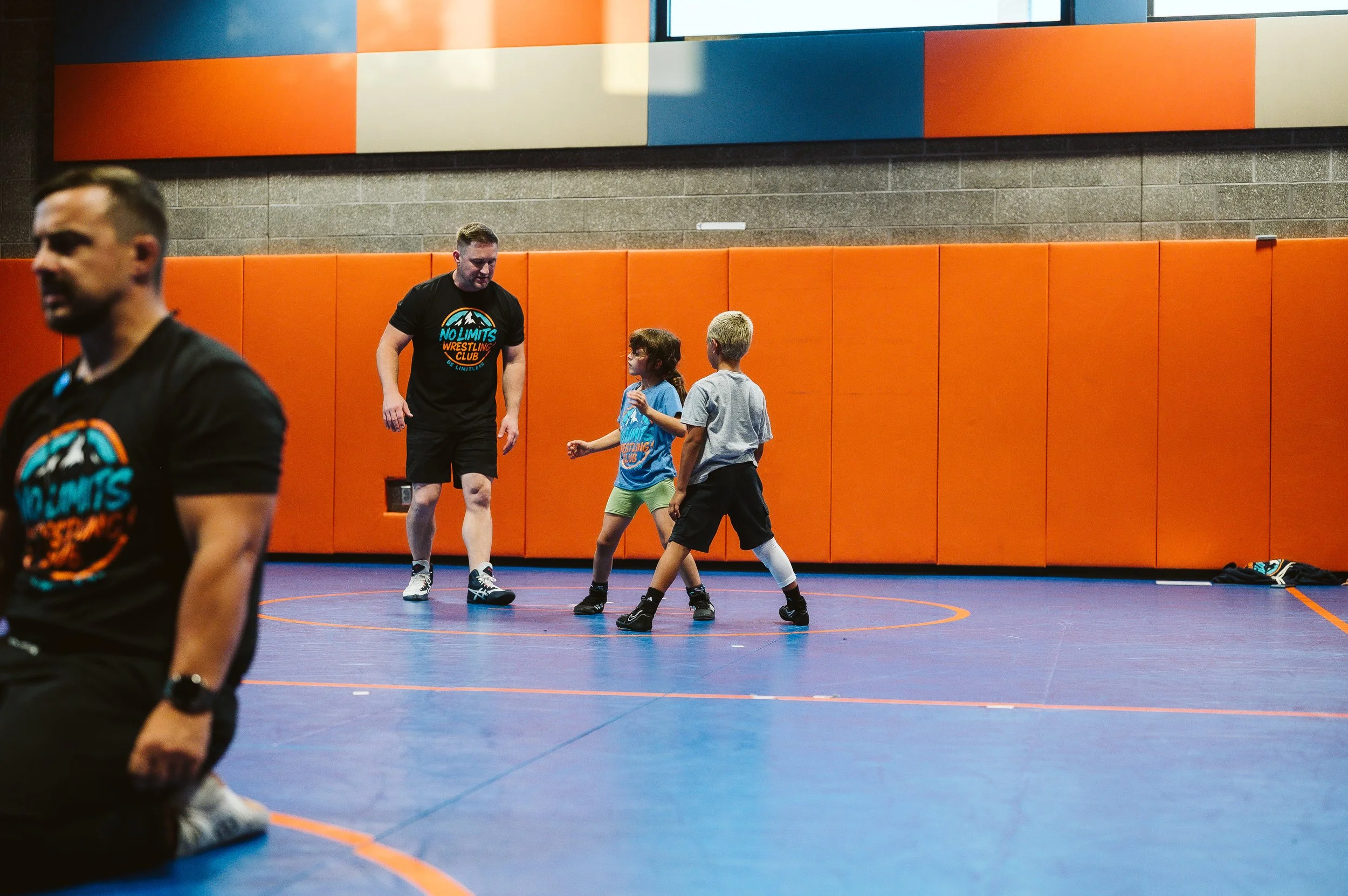 Youth athlete resting after practice, illustrating recovery as an essential part of athletic development.