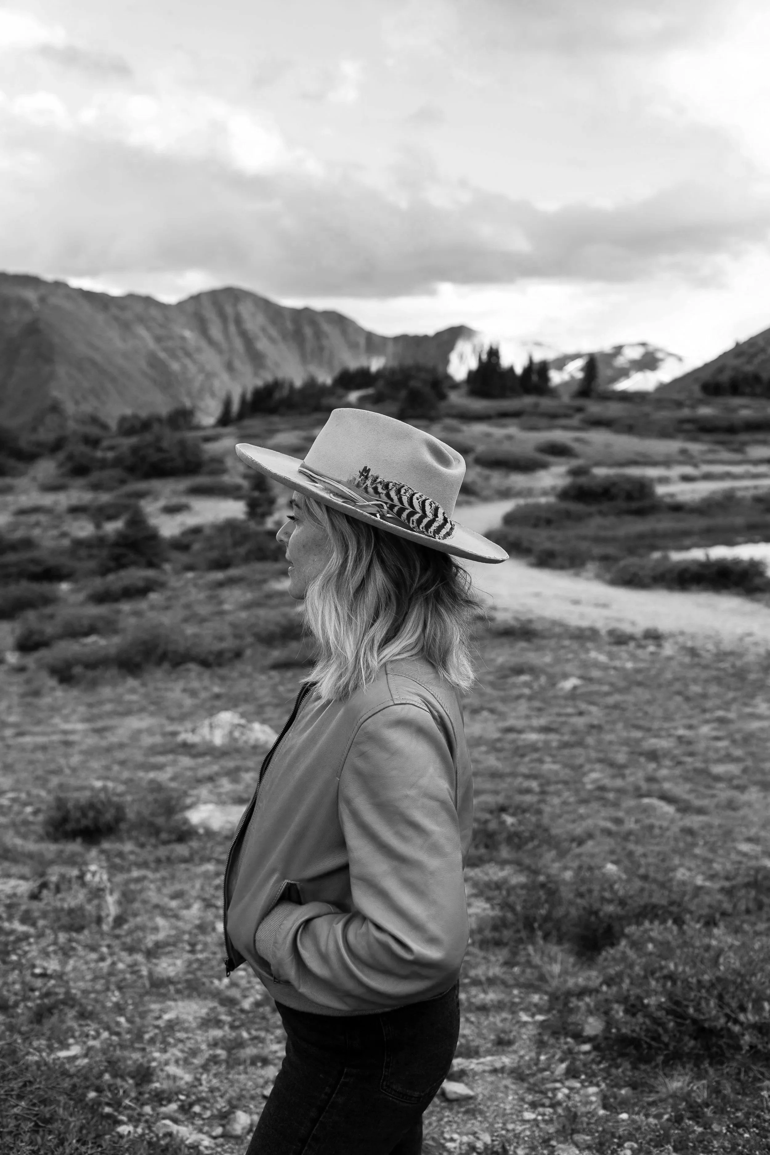 A woman looking over the mountains.