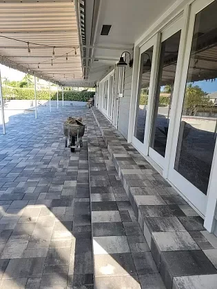 Pool deck pavers replaced to improve outdoor living comfort in Palm Beach, FL