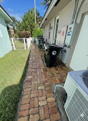 Paver walkway cleaned and stabilized to improve outdoor living flow in Lighthouse Point, FL