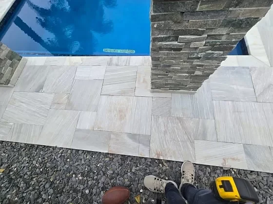 Close-up of pool deck pavers after re-sanding and sealing in Palm Beach, FL